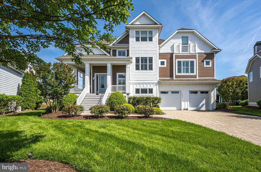 An entertaining oasis, this truly turnkey home is now available and ready for you and your family to enjoy.  Delivering fully furnished including recently installed all new custom, hand-crafted furniture throughout the main level.  This adds to the already stunning appointments on the other two levels of the home.  Other recent improvements include a new 85" premium wall mounted TV in the lower level, Brazilian wood furniture and motorized sunshade in the 3-season room directly off the primary bedroom, and 3 custom made designer sliding glass doors.  The luxury upgrades continue including a custom plate glass window in the upstairs studio with motorized blind and motorized window treatments in the dining room to perfectly match the living room.  Perched above the 13th hole of the pristine Jack Nicholaus Golf Course this home features water views from all 3 levels.  An abundance of outdoor spaces includes an oversized paver patio featuring multiple seating areas, outdoor speakers, a built-in grill, a gas fire pit, LED lighting, and an irrigated planter.  Three overhead fans provide relief on warm summer days when friends and family are visiting.  Entering the home directly off the paver patio you will be taken back by the lofty ceilings in the ground level entertaining space that includes a full granite bar, living room with a theater feel, and a ground floor guest bedroom with full bathroom.  If storage is high on your must have list, this is the home for you, with custom organizers installed in the storage room as well as in the garage and workshop.  The garage will be appreciated by car enthusiasts as the current owners added an epoxy floor coating, custom-designed cabinets with slat wall, and 2 new insulated garage doors including tracks, rollers, and ultra quiet smart door openers.  Moving upstairs to the main level note the custom carpet runners on the hardwood steps.  This level of the home impresses with vaulted cathedral ceilings adorned with millwork, a massive gas fireplace, and stunning custom drapes.  The oversized kitchen adds an additional eating area with a stepped-up granite bar that seats four.   The chef in your family will appreciate the induction cooktop, abundance of counter space for preparing meals, and oversized pantry.  A glass tile backsplash and additional glass fronted cabinets add to this space's "one of a kind" feel.  Just off the kitchen, the dining room now features a hand-crafted dining table with matching chairs and motorized blinds.  Moving into the 3-season room you will note the quality of the new Brazilian wood furniture and the ease of access to this room from either the great room or primary bedroom.  The primary bedroom features two walk in closets with custom organizers and plenty of space allowing for a hand-crafted writing desk for when a moment of creativity strikes.  After a day enjoying one or two of the plentiful amenities in the Peninsula or perhaps time spent on the beach, relax, and enjoy a bath in the standalone tub or the gigantic tile shower with rainfall showerhead.  The third level of the home is just as impressive as the others, including 2 bedrooms, 2 bathrooms, and a large office.  You can reach this level of the home, or any other, by elevator or steps.  This entire level features new carpet and hand-crafted furniture that will add to the comfort of your guests.  Most impressive from this level are the golf course and water views that can be taken in from the deck just off the guest suite.  Currently setup as a studio, but easily converted into a bedroom, this space allows for guest privacy.  When it is time for gathering this level features a loft area perfect for family bonding playing board games or watching TV.  The large office on this level greets you with oversized windows that flood the room with sunlight.  Last, but not least, a whole house generator in case of power outage.  Quite frankly, this home is as impressive as the community in which it resides.