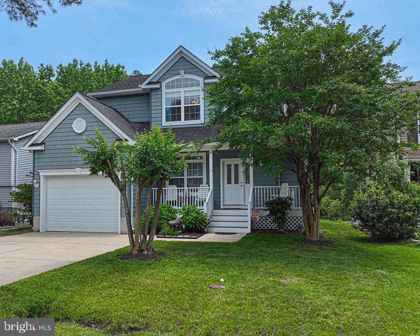 Waterfront without the fees! Private rip-rapped shoreline with boat dock, navigable to the open bay! Perfect for watching the wildfowl, fishing and crabbing. The sun shines into this appealing home through arched windows and 9' ceilings. This property has had constant updates including new Atrium Doors to the Trek Deck with vinyl railings, new stainless steel appliances, new shower, and the HVAC, new in 2019. You'll find a gas fireplace with alcove above in the living area, already wired for surround sound. Crown molding, glass cabinets, recessed lighting and a quartz countertop add class to the island kitchen. All 3 bedroom closets offer built-in shelving and drawers. The primary suite features 2 closets, tray ceiling, tiled 4 foot shower, and separate 5 foot whirlpool tub with tile surround and heater. A special hinged door gives access to the all concrete lighted crawl space with flooring pitched to the sump pump. Parking is available on the concrete drive or the single car garage, containing a closet, workbench and cabinets. There is so much more included with this special property, be sure to schedule your showing today!