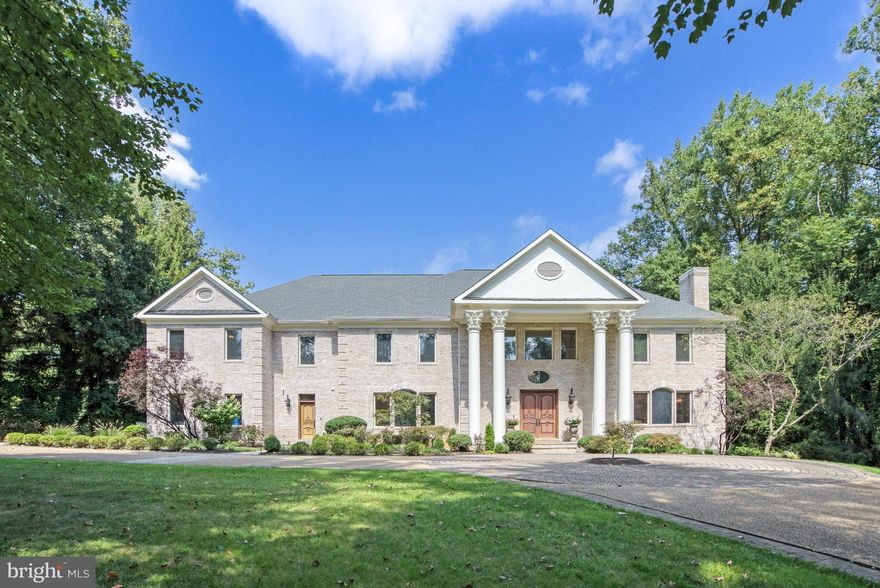 Welcome Home to this Beautifully Renovated and Upgraded Colonial in sought-after Woodside Estates. 
Peaceful Location with Backyard Oasis complete with Sparkling Pool & Nearly 2 Acre Lot! Gleaming Hardwoods on All 3 Levels with 5 Cozy Gas Fireplaces. Gorgeous, Remodeled Kitchen with Soft-Close Cabinets, Thermador Gas Range and Quartz Countertops that Waterfall on the Enormous Island. Truly a Chef's Kitchen with all High-End Stainless Steel Appliances. Light-Filled Main Level Office with Built-in Bookshelves. 6 Well-Appointed Bedrooms, including Large Primary Suite, with 4 Bedrooms Upstairs, One Main Level Bedroom & One Lower Level Bedroom, Perfect for In-Laws or Au Pair. Spa-Like Primary Bathroom is Spacious with Frameless Glass Shower Doors,  Double Vanity, Marble Tiles & Large Jetted Tub.  Huge Primary Bedroom Custom Walk-In Closet Would Make Carrie Bradshaw Swoon!  Large Upper Level Laundry Room.  Spacious Finished Walk-Out Lower Level with Stunning Wet Bar & Island, Theater Room & Fitness Room. Entertainers Backyard with Gorgeous Pool w/ Spa & Waterfall feature, Enormous Patio & Outdoor Fireplace is Surrounded by Mature Trees for an Idyllic & Private 2 Acre Refuge.  Langley HS Pyramid. Newer Roof. Close to Metro, Beltway & Tysons Corner, as well as Dulles & National Airports.