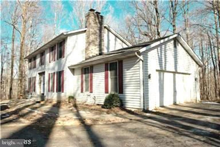 Exclusive opportunity to live in this beautiful home situated on 2.35 acres! Loads of updates including, beautiful granite, gorgeous wood floors, fireplace of each level, 3 large bedrooms upstairs and 2 more good size rooms in the lower level that can be used as additional bedrooms, wet bar, family on main level, 2 story foyer, some new carpet, huge master bedroom and bath with soaking tub.