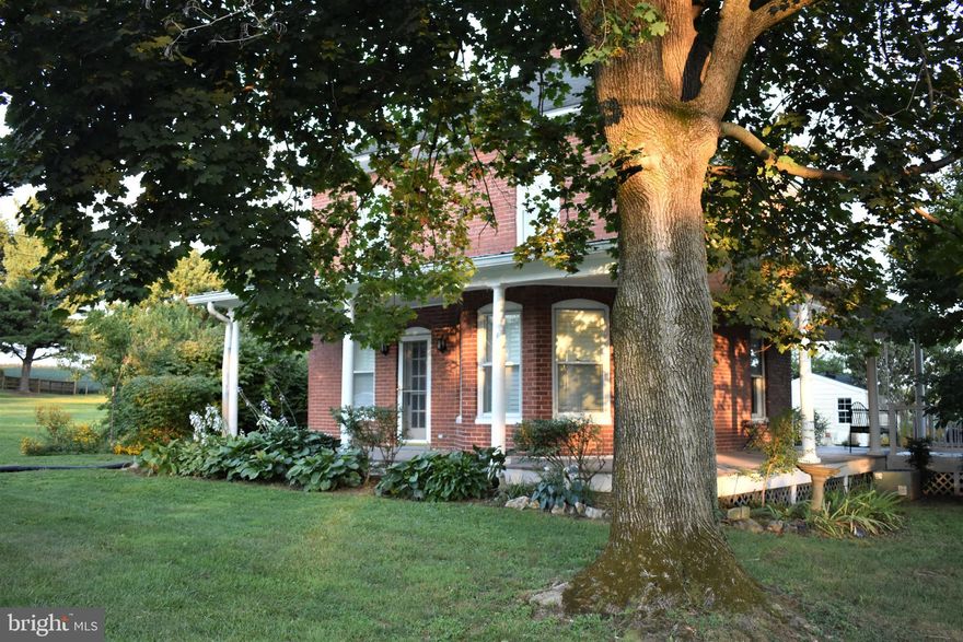Enjoy rural living in this 1923 well maintained, all brick single family home.  This quaint 1,132 sq. ft. home features 3 bedrooms and 1.5 bathrooms, plus a small unfinished basement. The main level has an attractive kitchen with quartz countertops & Amish-built cabinets, a living room and dining room w/ a stained glass chandelier.  The home has stained wood flooring throughout (except the bathrooms) and lots of windows for plenty of natural light. Enjoy the 3-sided wrap-around covered porch with painted wood floors, plus an attached composite deck.  Oil radiator heat and Central Air Conditioning.  There is a small, detached building with heating and cooling that is ideal for a private office or exercise room. The almost half acre lot backs to a farm providing a pleasant setting. Tenant to mow and maintain yard. Great location with easy highway access.  (Photos from previous listing) 2-year minimum lease required. NO PETS.  Credit Scores 650+for all adult occupants. No Smoking. Tenant Occupied.