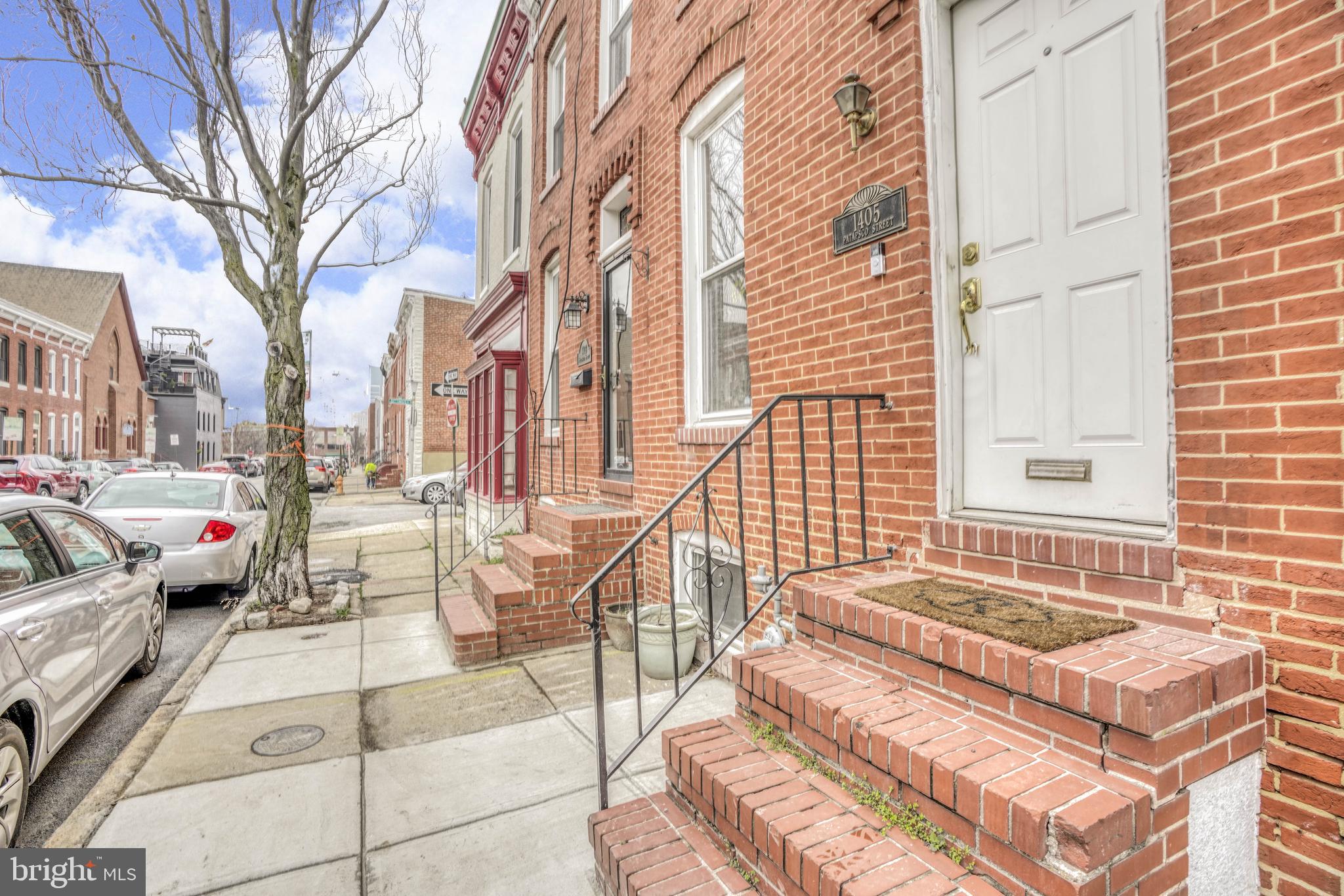 Wonderful 2 Bedroom, 2.5 Bath Renovated Rowhome with PARKING in the Heart of Federal Hill! This lovely home features wood floors, an open layout, exposed opening to 2nd floor, 1/2 bath, gourmet kitchen with counter and table space leading to a rear parking pad. 2nd floor features 2 bedrooms and 2 full baths with rear master bedroom with master bathroom and spiral staircase to pop up with views of the city. Basement is partially finished with large open recreational room for entertaining or guest bedroom/office. Make this your new DREAM HOME NOW! Start living the CITY LIFE!