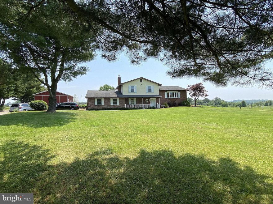 Gorgeous scenic views await you at this beautiful 3+ acre farmette where you are able to enjoy the privacy and tranquility of being located at the end of a long, private driveway.  This 3 bedroom, 2.5 bath home features all of the modern conveniences yet provides you with enough land to create your very own farm.   The kitchen has been updated with stainless appliances and granite counters.  All new carpeting throughout and updated flooring in the family room.  The sunroom is the perfect place to take in the breathtaking views from all angles.   Farm animals are welcome here so bring your horses, chickens and goats to roam the fenced rear yard.  The 30 x 40 pole barn/out building comes complete with electric and a concrete floor and is the perfect place to store your farm equipment.