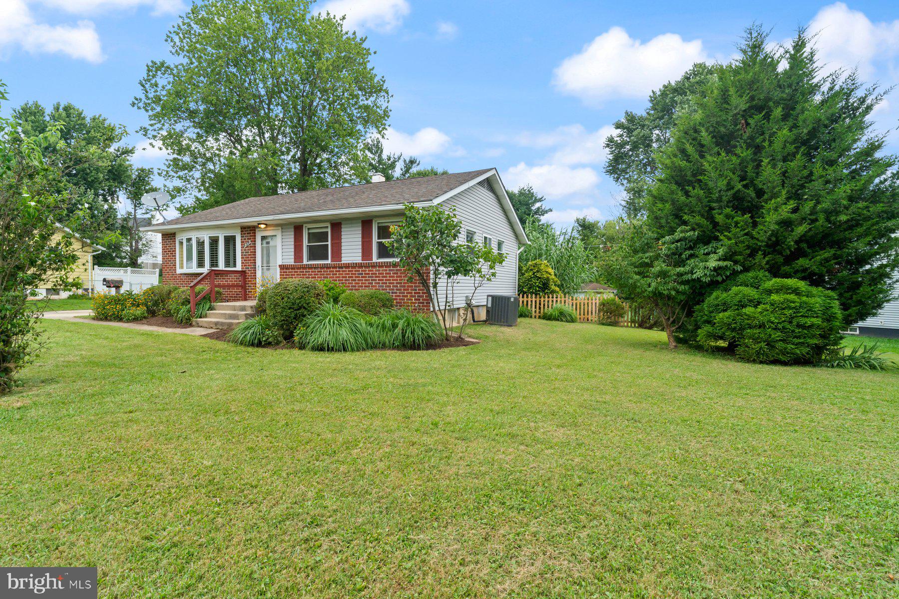 Adorable 3BR/1BA Rancher on a sprawling lot in a quiet neighborhood. Park in the spacious driveway just steps from a lush green lawn, manicured landscape beds, adult trees, and the front door into your forever home. Step inside a newly refreshed home featuring tons of natural light, ceiling fans, recessed lighting, and a freshly painted interior. The main living space boasts an open concept living room and dining room, and kitchen offering plenty of cabinets, tiled countertops and backsplash, and a porcelain sink. Down the hall are two sizable secondary bedrooms, a large primary bedroom, and a newly remodeled full bath. The lower level is finished offering additional living space featuring a family room with a custom bar, laundry, and plenty of storage space. From the kitchen step out onto a wrap-around deck with sliding doors to a spacious screened-in porch that overlooks a fenced yard filled with an abundance of green space, landscaping, adult trees, a shed, and so many possibilities. This home is move-in ready and located in close proximity to and shopping, restaurants, and commuter routes.