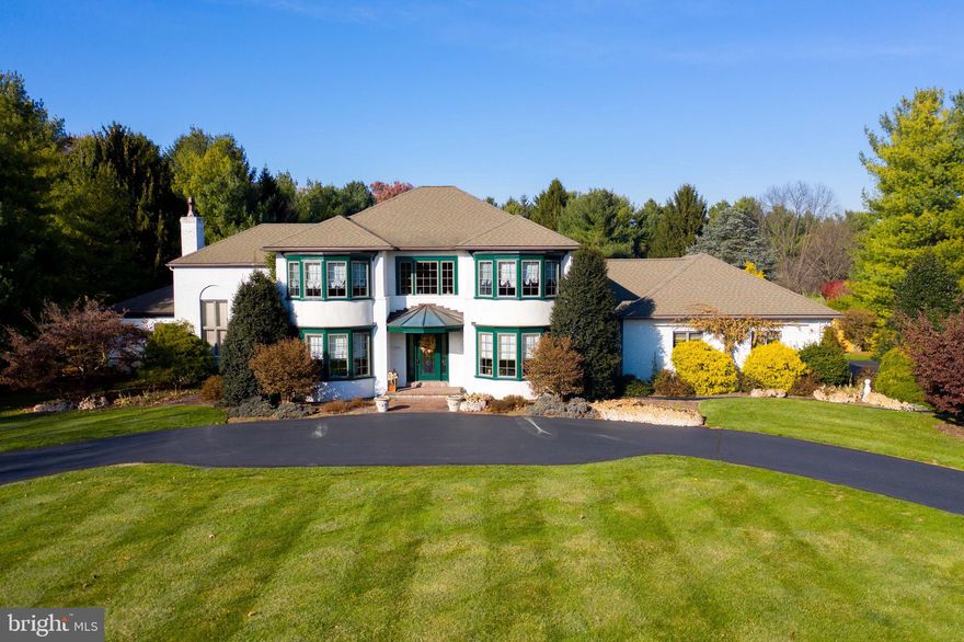 5 bedroom home in Manheim Township's Stonehenge development with meticulous detail throughout. Home features a white kitchen with breakfast bar, granite and tile backsplash, 2 story sunken family room and first floor laundry and office.  Master suite addition on first floor featuring tray ceilings, crown molding, fireplace, 2 walk in showers and soaking tub. 2 separate basements, one finished with coffered ceiling, built ins and workout area and the 2nd unfinished with plenty of storage. Large private backyard with extensive landscaping and in ground pool.  Other details include crown moldings, gold left ceiling, custom trim work and custom paining by John Klan.