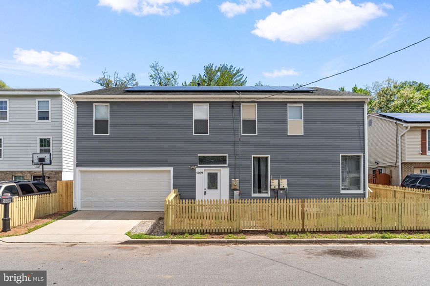 STUNNING fully renovated multi-generational home with 3,000+ SF across TWO independent levels! 7 BEDROOMS | 3 FULL BATHS

Main level features open-concept living/dining, designer kitchen with black quartz countertops, white shaker cabinets, LG stainless steel appliances, gas range, and brand-new washer/dryer. Luxury vinyl plank flooring throughout. Upper level includes 4 spacious bedrooms and 2 fully renovated bathrooms with marble-look tile, quartz vanities, and modern black matte finishes.

Enjoy outdoor living with a large elevated rear deck overlooking a fully fenced, tree-lined backyard.

Lower level offers a PRIVATE entrance in-law suite complete with full kitchen, 3 bedrooms, full bath, and open living area — perfect for multi-generational living, rental income, or guest space.

Additional highlights include:

2-car attached garage
Full rooftop solar panel system (energy savings)
New privacy fencing around entire property
Designer finishes throughout
Move-in ready — like new construction!

Prime location — minutes to Washington, DC. MUST SEE!