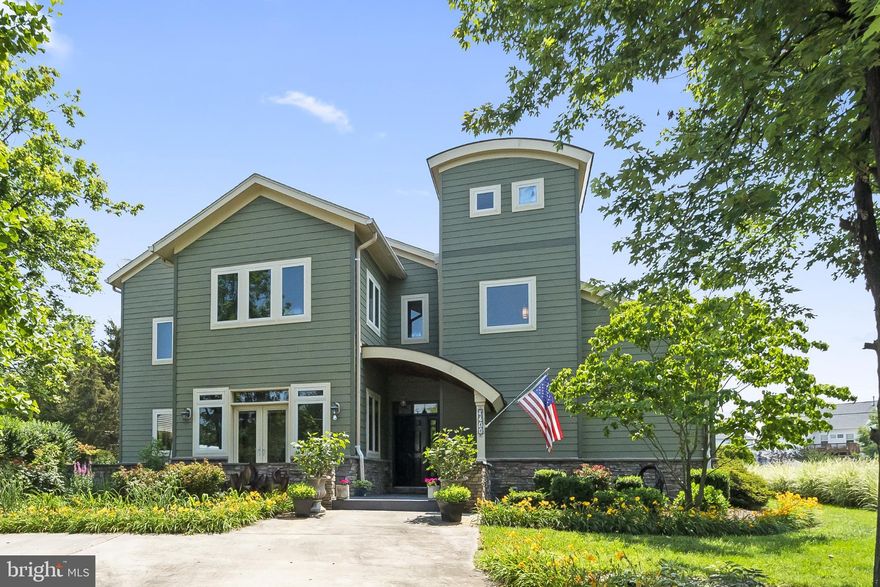 Architectural Beauty!  RENT INCLUDES ALL UTILITIES, LAWN CARE, MONTHY HOUSEKEEPING, AND FURNITURE!  Nestled on neatly 1 acre of professionally landscaped grounds, "The Speer House" is a one-of-a-kind architectural gem designed to harmonize with its natural surroundings. Expansive energy-efficient casement windows flood every room with natural light and frame panoramic views of the lush gardens and wooded landscape. A serene retreat that blends sustainable luxury with everyday comfort.  The main Level features open concept elegance - a gourmet kitchen w/stainless steel appliances, induction stove, stainless counter w/integrated double sink, quartz peninsula, custom wood island, convection microwave, and dumbwaiter; dining nook; 2-story family room w/floor-to-ceiling stone fireplace; primary suite w/designer finishes, luxury bath, water closet w/ bidet, and a two-person sauna; office/exercise room, half bath.  The upper level is designed for family & guests and has three spacious bedrooms, two full baths, hardwood and luxury vinyl flooring, unique architectural details including two interior bridges overlooking the family room, and private balconies with peaceful views of the patio and gardens.  The fully finished basement is an entertainment haven with a large rec room w/home theater, leather recliners, deluxe poker/gaming table, 8’ slate pool table, full bath, laundry room, utility sink, and multiple storage areas.  Outdoors the living is redefined by an inviting front porch w/covered slate entry, cultured stone surround, large backyard patio with stone fireplace, patio furniture, umbrella, hammock, and mature landscaping.  Live the Lorton Lifestyle - enjoy a rare combination of scenic tranquility and urban access with minutes to Mason Neck State Park, Occoquan Regional Park, Pohick Bay, and the Potomac River; easy commuting via I-95, VRE, Route 1, and Fort Belvoir; close to local shopping, farmers markets, top-rated schools, and healthcare; and you can explore the Workhouse Arts Center, dining, and community events.  The Speer House is more than a home—it's a lifestyle - offering timeless design, luxurious amenities, and connection to nature in one of Northern Virginia’s best-kept secrets.  Schedule a private tour today!