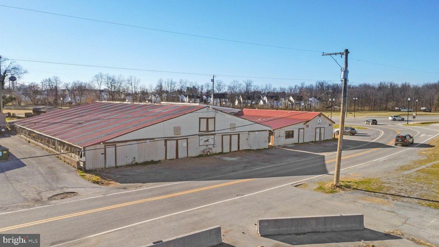 PRICE REDUCTION! Very motivated seller. Priced way below appraised value. Fantastic opportunity to own a unique, mixed-use property. Improvements consist of a 47 stall barn with 4 tack rooms, equine pool, large tack room, and two 2 bedroom apartments.  Located beside Hollywood Casino at Charles Town Races yet privately owned. 
The 47 stall barn contains 11,250 sq. ft, wood siding, and a metal roof. The barn with the huge tack room has central air conditioning, concrete floor, half bathroom, and provides tons of storage. Combined with the pool this barn contains 6102 sq. ft.  The 2 identical twin apartments above contain 2262 sq. ft. and have a wraparound deck. There is parking on the right side of the barn and in front of both barns.  Several trailers and trucks will fit nicely. Property is being sold as-is.