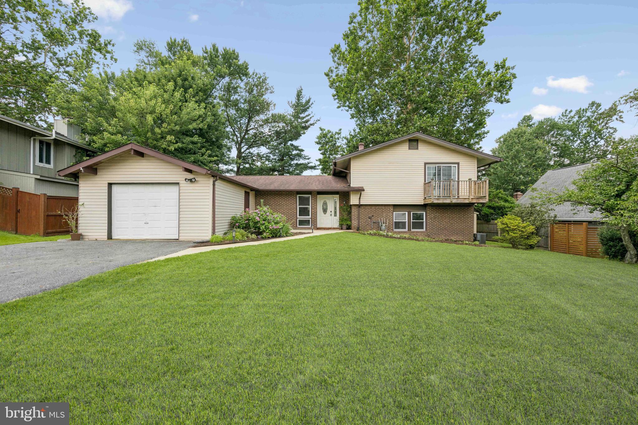 Tucked away in the desirable Brookeville Knolls neighborhood, this refreshed split-level offers the perfect blend of functional living, tasteful updates, and prime location. This home offers four spacious bedrooms and three full bathrooms across 2,002 square feet of living space. Enjoy a sunlit kitchen with bar seating and seamless flow from the dining room to the rear patio, ideal for entertaining or everyday gatherings. The main level also features a spacious living room with built-in shelving. Upstairs, the primary suite includes double closets and a private balcony, along with two additional bedrooms and a refinished full bathroom. The lower level offers a versatile recreational room complete with a wood-burning fireplace, bar seating, and a dartboard, perfect for game nights. A fourth bedroom, another refinished full bathroom, and a laundry/utility room complete this level. Additional highlights include a one-car attached garage, a large driveway, ample storage, and lush green front and back yards. The Brookeville Knolls community has something for everyone, with a large swimming pool, picnic areas, tennis, pickle ball & basketball courts, and more. Commuters will appreciate the quick access to Route 97 and the ICC/MD-200, plus convenient public transportation options that connect you to downtown Silver Spring, Rockville, and the surrounding metro area. Everyday errands are a breeze with shopping just minutes away at Olney Village Center and Layhill Shopping Center, where you’ll find supermarkets, restaurants, and daily essentials all in one place. If you’re looking for a bright, versatile home in an established neighborhood with unbeatable amenities and easy access to everything you need, this Brookeville Knolls gem is ready to welcome you home. Schedule your private tour today and imagine the possibilities!