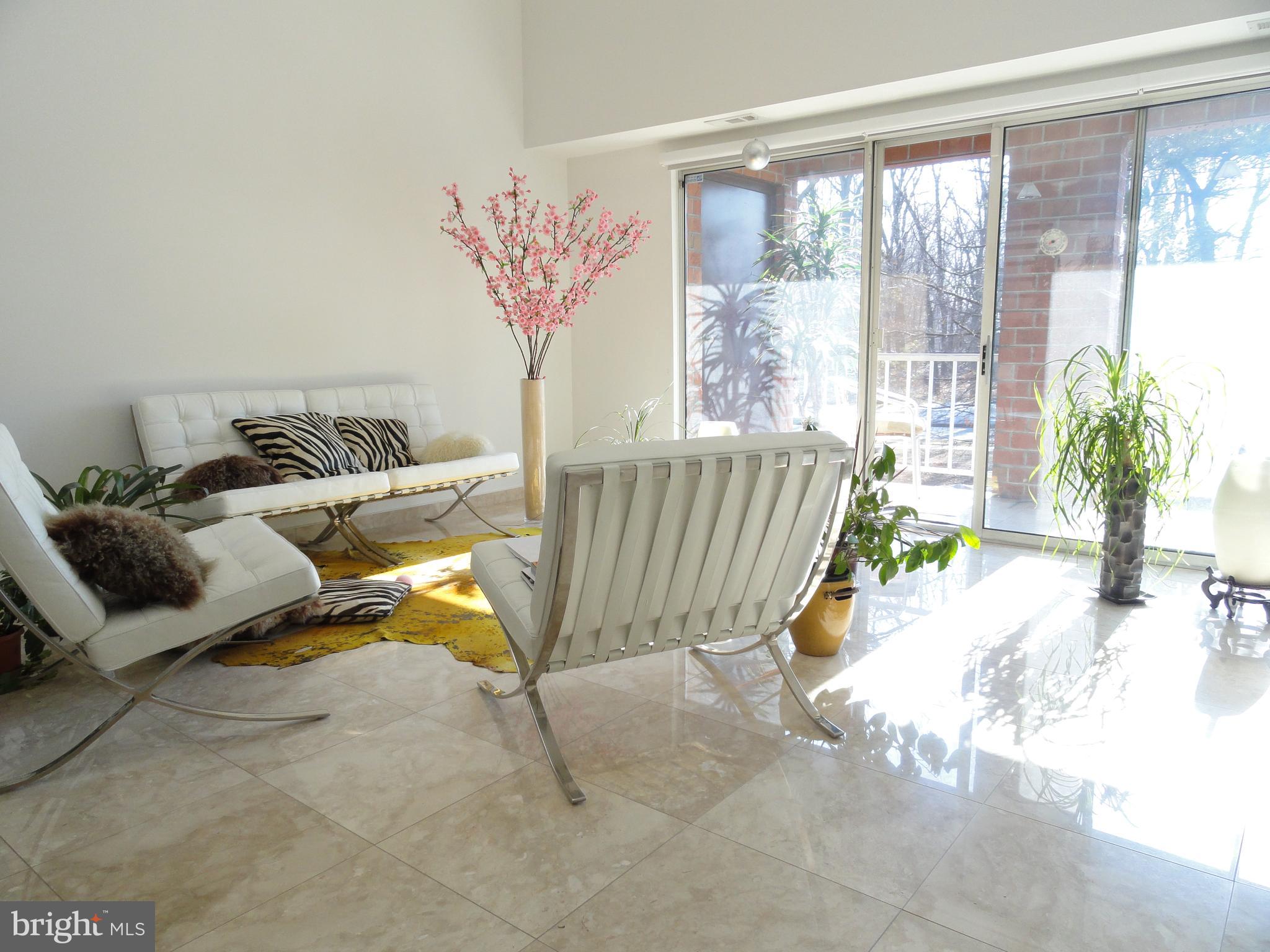 This luxury bi-level a 2200sq foot 2 bedrooms and 2 bathrooms +loft condo is featuring Italian marble floors thru the entire house and balcony. Cathedral ceiling with all custom low voltage recessed lightening and large windows allow plenty of natural light creating airy, specious, and bright environment. This is rare brick and concrete house.
All windows have aluminum frames and double pockets (3 layers of glass), sound and weather protection. UV protected glass on all windows.
1st floor featuring an open floor plan with kitchen, living room, dining room, 2 big bedrooms, full bathroom, and large balcony with storage.
The bathroom is finished with large (24” x 48”) polished Italian porcelain tiles floor to ceiling, full size deep bathtub, custom recessed lightening and high end fixtures.
2nd floor is a specious loft that can be converted to 3rd bedroom, laundry room, and full bathroom. Separated laundry room on the 2nd floor with large storage.
The unit has 2 full AC systems: one for each floor. Japanese Tankless water heater. No neighbor houses in front of any window.