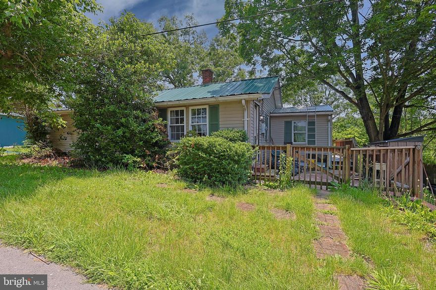 All information is believed to be correct. Buyer to perform own Due Diligence. Located on an unrestricted .58ac, this property is conveniently located on the MD line and minutes to I-70. This 3 bedroom/1 bath home offers 1,008 sq. ft. of living space. Inside, the kitchen features painted cabinets, a walk-in pantry, and space for a window-type air conditioner near the sink. The kitchen flows into the living room, and two of the bedrooms include built-in cabinets. Flooring is a mix of vinyl tile and carpet throughout.

Outside, the property includes a wood fence and gate that also functions as a front deck, plus an additional side deck that could serve as a quiet outdoor spot. The yard, both front and back, could use mowing and general cleanup to bring out its full potential. While the home does need some cosmetic work and could use a little TLC, the property will be cleared of all furniture and personal items before closing. Washer/dryer, shed, and appliances included with the sale.