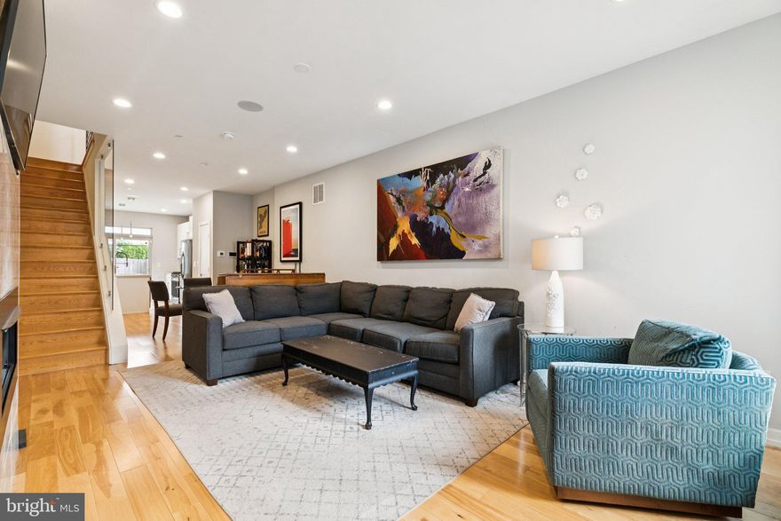 Welcome to 2339 Dickinson. This modern 4-bedroom, 3-bath home in Point Breeze right by Wharton Square Park offers bright, open-concept living with high ceilings, hardwood floors, and a contemporary design throughout. The main level features a spacious living and dining area that flows into a sleek kitchen with tons of cabinet space, stainless steel appliances, quartz counters, and a large island—perfect for entertaining. Just outside the sliding doors is a large patio great for entertaining or relaxing. Upstairs are two spacious bedrooms, a full bathroom, and laundry room. On the top floor is a Primary suite with wet bar, walk-in closet, a light filled bathroom with glass enclosed shower and double vanity, and a private southern facing balcony.  The fully finished lower level offers bonus living space and a full bath, ideal for a media room or guest suite. A private rooftop deck showcases stunning city and sunset views, completing this stylish home. Located by the park and with easy access to the shops and restaurants on Washington Avenue,  major highways, and public transportation, 2339  Dickinson Street combines modern comfort with the ease of city living.