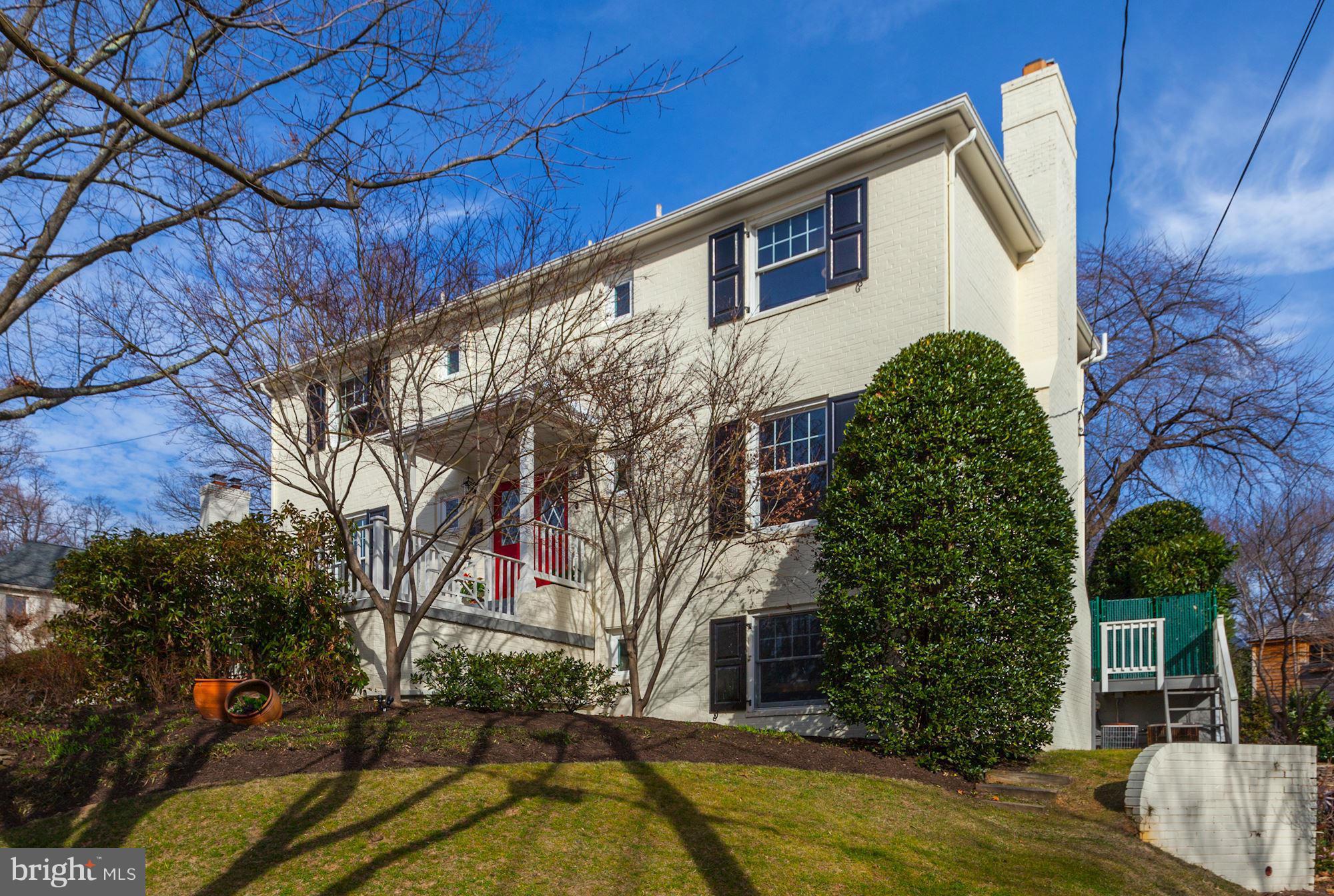 NEW LISTING! Gracious brick colonial with over 4000 SF on sought-after street. Five bedrooms, three and a half baths, open kitchen/family room with soaring cathedral ceiling. Generously sized principal rooms and three-season porch. Updated kitchen and baths, finished lower level with great light. Flat rear yard. Walk to Woodacres Elementary and Little Flower. OPEN SUN 1-4!