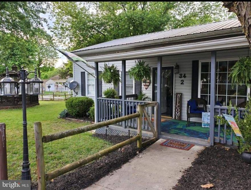 RIVER COMMUNITY- just come and enjoy this move in ready 3 bedroom 1 bathroom home in a gated seasonal river community. This seller will convey most all the furniture and a golf cart. Home has a bar inside for entertaining and a Gazebo for those who want to be outside. Community has 3 pools, playgrounds, mini golf, horse-shoe pits and most important Deep-Water River Access. Community boat launch allows for you to unload your boat without leaving the community. River is deep water for swimming, tubing and water skiing.  With a store, restaurant and bar inside the community you really never have to go outside the gate. River Bend is full of community activities for the adults and children the entire season.  Escape it all and become part of a community full of fun. Don't hesitate or you'll miss out. CAN NOT LIVE AT THIS HOME YEAR ROUND