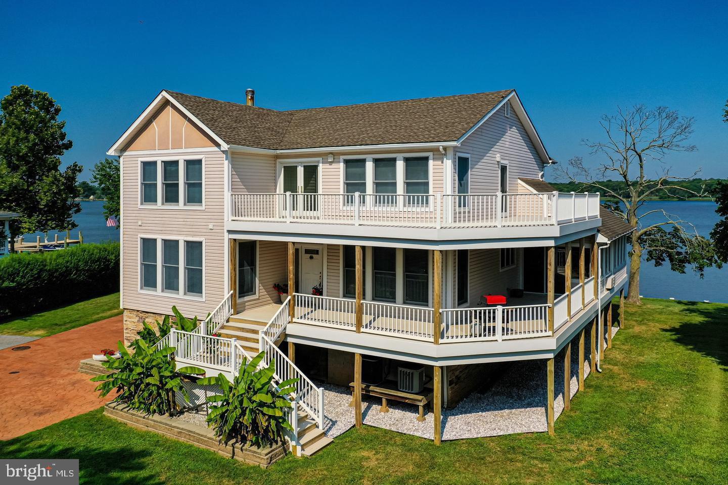 Welcome to the home of 6800 Gunder Ave, the meticulously crafted waterfront gem sits in the West Twin River neighborhood of Baltimore County****Upon entry the main floor is the foyer and hallway with refinished wood flooring, with the dining area to the right, an office to the left****On the left of the hallway is a custom half bath with specialty nautical themed sink and toilet****The third bathroom was added in 2023 to provide extra convenience****The hallway divides into an expansive living room with extra high two-story ceilings and massive windows that frame the waterway and sunsets beyond****The large gourmet kitchen is fully equipped with all appliances, including wall oven, cooktop, and custom finished sub-zero refrigerator****Large Corian countertops and massive breakfast bar give plenty of room for prep and casual dining while admiring the view****The custom cabinetry has been newly refinished, and the backsplash is made of rolled marble****A door off the right of the living room leads to an unique room of ceramic tile flooring, vaulted ceilings, eating crabs while enjoying the spectacular views for the families or friends***On the left of the living room is a short hallway that leads to the main floor owner’s suite****The owner’s suite, as well as the living room, both have sliders that open out onto the waterfront deck. Along with the view, the owner’s suite hosts walk in closets as well as its own large custom bathroom****Amenities in the bathroom include double vanities, make-up station, roomy shower with custom frameless glass door, jacuzzi tub with waterfall spout and custom fixtures throughout****The upper floor has 4 decent size bedrooms. Two of these rooms are bedrooms with walk-in closets, and a bathroom that connects between them, each side has its own private toilet/sink area, and a shared tub/shower combo in the middle****The other two rooms could serve as guest rooms, offices, hobby/craft rooms, workout rooms, playrooms etc.****There is an overlook in the upstairs hallway that looks down into the living area and out at the massive architectural windows onto the water beyond****Atrium doors off the second-floor hallway, and a single door on the other side also lead to a second large wrap around balcony giving you a panoramic view of the waterfront and neighborhood surrounding****Stairs down to the first-floor lead to a large unfinished area that holds tons of shelving, cabinets and a workbench. There is no shortage of storage here! A door from this floor leads into the carport, and sliders off the back exit out into the waterfront backyard****Please show it today and your clients will not be disappointed****