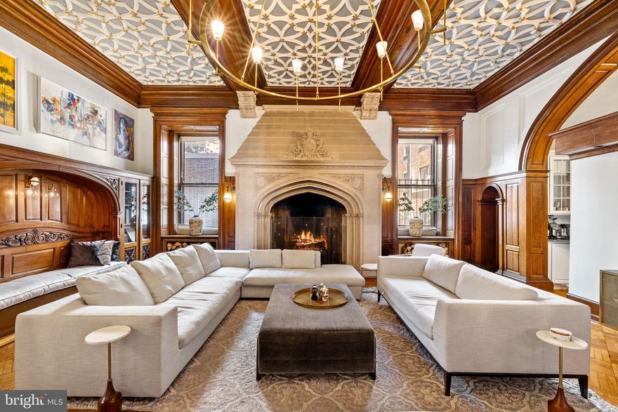 Indulge in the grandeur of Chandler Place, a magnificent property of great historical significance situated in the highly coveted Fitler Square neighborhood. Originally designed in 1904 by the renowned architect Theophilus Chandler for the Episcopalian Bishop of the Pennsylvania Archdiocese, this distinguished mansion was transformed in 1980 into ten luxurious condominium units by the equally celebrated architect Otto Spur. As you approach, the building welcomes you with a private front door entrance, setting the tone for the refined blend of historic charm and modern convenience that awaits within. The courtyard and tree canopy create a serene backdrop for this architectural landmark in the heart of Center City. Enter the visually stunning formal living area, where original details have been meticulously maintained. Hardwood floors with intricate inlays of walnut and mahogany , soaring ceilings, and large windows frame the space, accentuating intricate molding and woodwork. A grand fireplace adds warmth and character, creating an ideal setting for entertaining guests. The first-floor bedroom features 14ft ceilings , oversized windows, own en-suite bathroom and mahogany mantel fireplace & the parquet flooring . Indulge in opulence within the  where luxury reaches new heights. The sweeping staircase leads to the second bedroom suite with a decorative fireplace,  large custom wardrobe and en-suite bathroom with a double vanity .  The spa-like ambiance is heightened by an expansive glass stall state-of-the-art luxury Steam Shower by Hansgrohe. Immerse yourself in relaxation with the modern soaking tub that beckons you to unwind in style. The lavish ambiance is further accentuated by floor-to-ceiling stone tiling that envelops the space in sophistication, creating a seamless fusion of modern aesthetics and timeless elegance.  Every detail in this luxury bathroom reflects a commitment to superior design and craftsmanship.  This pet-friendly residence is strategically located between Rittenhouse Square, Fitler Square, and the Schuylkill River Trail and dog park. Enjoy easy access to hundreds of Philadelphia's top restaurants, shops, and cultural landmarks, with quick connections to major highways like 676, 76, and 95 for convenient travel. The nearby 30th Street Station makes commuting to NYC a breeze, taking just about 1 hour on the Acela train. Discover the epitome of Philadelphia living at Chandler Place, where historic elegance meets contemporary luxury in a coveted Fitler Square.
