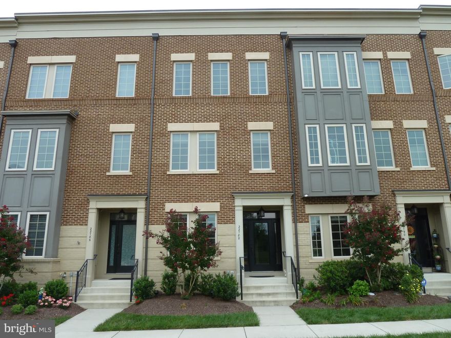 Attractive Brownstone TH in desirable Brambleton.   Lower lvl BR & FB.    Main lvl with living/dining room, kitchen & HB. Top floor with spacious MBR w/ walk in closet. Another FB, large 3rd BR, front load washer & dryer.  Crown moldings throughout.  Oversize 1-car garage w/ lots of storage. Plenty of parking. Great facilities & close to Town Center (Shopping/Movies/Restaurants).