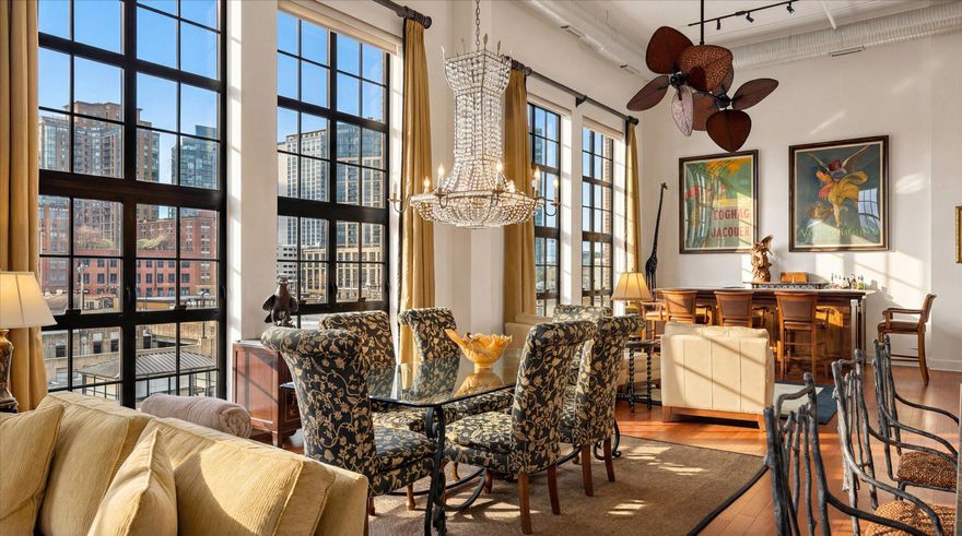 There’s a certain ease to life here, where light pours in, the city feels within reach, and every detail has been thoughtfully considered.

Ideally located on the fourth floor of the Canal Street Malt House, this residence is defined by its dramatic floor-to-ceiling windows, framing captivating views of the Harbor East skyline. From morning light to evening glow, the home is constantly shifting in the most beautiful way; bright, open, and effortlessly inviting.

The main level is designed for both everyday living and entertaining, anchored by a chef’s kitchen complete with a Wolf range, wine refrigerator, and an expansive island that naturally becomes the heart of the home. A main-level ensuite bedroom offers flexibility and comfort, whether for guests or a more private retreat.

The second-floor primary suite feels like its own quiet escape. Lofted and open, yet deeply private. Thoughtfully scaled, it features an expansive walk-in closet and a spa-inspired bath with a soaking tub, creating a place to truly unwind at the end of the day. Just beyond, a spacious balcony overlooks the building’s landscaped courtyard; an unexpectedly serene backdrop in the middle of Little Italy. Throughout, generous proportions set this residence apart as one of the larger floor plans in the building, offering a sense of space that’s increasingly rare in city condo living.

Garage parking with one assigned space adds a layer of convenience to an already elevated lifestyle.
See why the Canal Street Malt House is one of the most coveted addresses in Baltimore. In the heart of Little Italy, a few blocks from Harbor East, waterfront promenades, and some of Baltimore’s most beloved dining destinations, this is city living at its most refined.