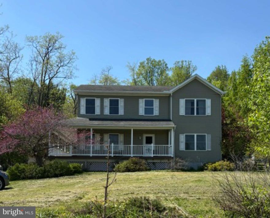 Perfect opportunity to own this spacious 3-bedroom 2 story with a dedicated office and finished lower level with half bath.
Situated on a .9 acre lot with fenced yard, a 2 car garage that includes an additional 12x12 workshop ideal for those special home projects and plenty of room for everyday living while enjoying that special wrap-around porch. 
The spacious interior  offers  all the daily conveniences .  Heat -pump with Central Air, first floor Laundry, wood Fireplace, full pantry, half bath,  and impressive floor to ceiling entry .   Move in and with a little TLC make this home your castle !