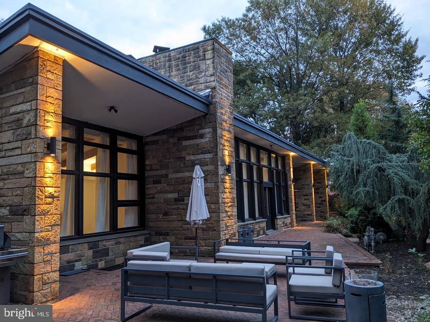 Opportunity knocks! Artfully designed in 1953 by native Philadelphian architect, Harry
Sternfeld, this stunning and unique 5 bedroom, 4.5 bath, mid-century modern home has
served as the backdrop for a documentary, an Urban Outfitters catalog, and multiple
other features. The light that permeates this home through the many large dramatic
windows, is magical.
Enjoy the spectacular outdoor spaces and grounds – the herringbone brick terrace
overlooking the parklike setting, perfect for outdoor entertaining, the backyard treehouse
and the side garden with a “secret” patio and greenhouse. 
Other special features of this home include an entrance hall with imported Italian marble
floors, open-plan living spaces with vaulted ceilings, wood beams and a wall of windows
overlooking 1+ acres of beautifully landscaped grounds. The living room fireplace is a
wood-burning stove with an exquisite rare black Carrera marble mantle. The first-floor
family room with vaulted ceiling and built-ins is located next to the expansive first floor
primary suite with sitting area, walk-in closets, and access to an attached greenhouse.
Upstairs, an optional guest suite with ensuite bathroom and attached sitting
area/optional 6th bedroom, 2 additional large sunny bedrooms, a hall bath and loads of
storage. The 5th bedroom and full bath are in the lower level, together with a play area
and access to the outdoors.  
Walk to houses of worship, library, and parks, as well as the Main Streets of Narberth
and Bala Cynwyd.  Minutes to the 76 and downtown Philly. Award winning Lower Merion
Schools. This special home is not to be missed.  
Upgrades made by current owners:
Replaced siding 2021.Hardie board black and white
Complete primary bath renovation - 2021
Renovated 2 upstairs bathrooms - 2021.
Updated powder room
Shower added to lower-level bathroom. 
Replaced 26 windows upstairs, kitchen and master bathroom - 2022. Bella Reserve Contemporary. Pella Imperva in the bathrooms. 
Water heater - 2021 
2 x central air systems both Goodman 5 ton - 2018
Concrete flooring in living room and passageway 2017
New hardwood floor in the dining room - 2018
Hardwood floors upstairs - repaired and refinished
Landscape lighting added.
Ceiling beams – sandblasted.
Expansive new mudroom with custom closets, enclosed breezeway, new glass
framing.