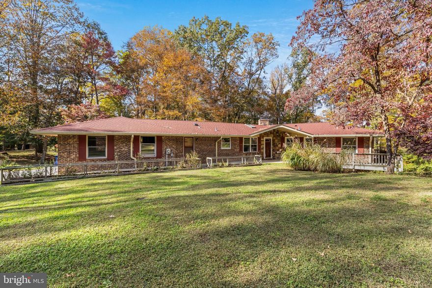 Sold as-is . Love nature & seclusion?  Huge 2 level barn that comes with 150-amp service. Second barn has electric,  fireplace and the farm offers two deep wells + a fishing pond. Great for hunting.  This custom rambler has 4 fireplaces, five bedrooms two and a half bathrooms, two sunrooms, two car garage and much more!  Nature abounds among the native towering trees. 18 + acres.