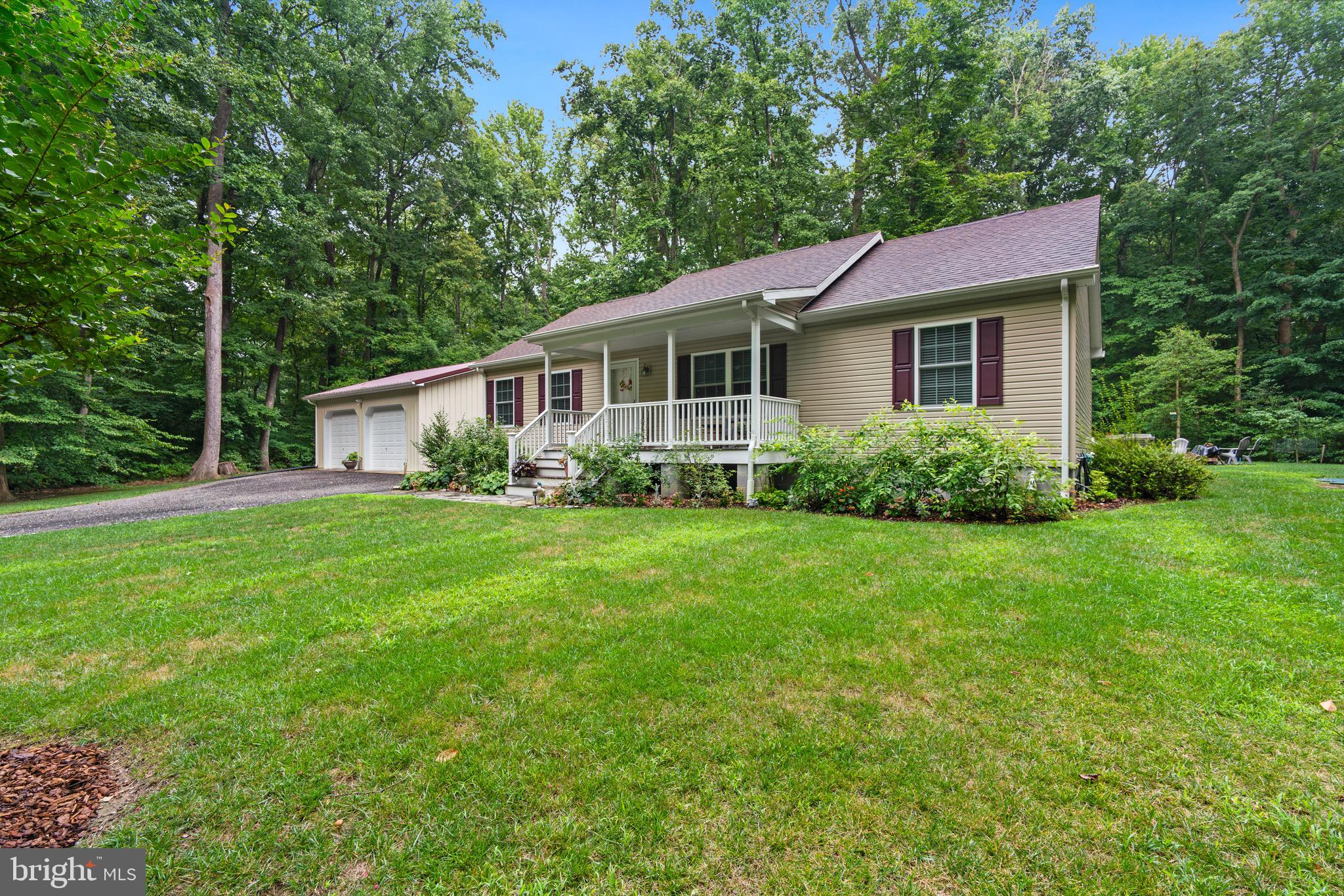 Welcome to this charming raised rancher, built in 2015and located in the water-privileged community of Chesapeake Landing. This beautiful home features 3 spacious bedrooms and a desirable split bedroom floor plan, offering privacy and comfort for all. The open floor plan creates a seamless flow from room to room, enhancing both functionality and style, and offers a large kitchen with stainless steel appliances. Outside, you'll find meticulously maintained landscaping, complemented by mature trees that provide shade and a serene atmosphere. Enjoy evenings around the firepit stone circle or relax on the expansive 10x48 concrete patio. The property also includes a detached 2-bay garage, perfect for vehicle storage or a workshop and 2 additional parcels totaling 1.61 Acres. This home is equipped with numerous amenities, including a conditioned crawl space, gutter guards, and a tankless water heater, ensuring comfort and efficiency year-round. Nestled in the desirable Chesapeake Landing community, you'll have access to wonderful water privileges, making it perfect for those who enjoy boating, fishing, and waterfront activities. Don't miss out on this unique opportunity to own a home that truly has it all – modern comforts and ample space, all in a sought-after waterfront community!