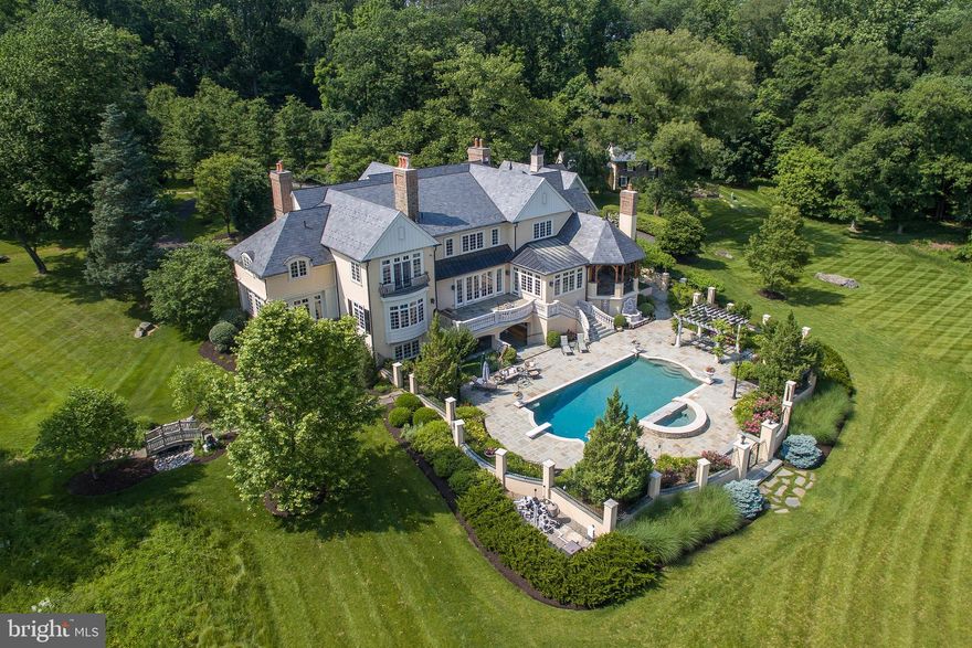 This magnificent estate property on 50 secluded, preserved acres offers an exquisitely finished custom home, restored stone 4 BR 3 Bath Guest House, & totally restored 1739 farmhouse, now a 2-story, 2+car garage/equipment barn. In addition, the property is a great mecca for entertaining with a heated salt water pool & spa w/ outdoor pergola, outdoor terraces, tennis court, 13 ft. deep stocked pond w/gazebo, fruit tree orchards, 16 Ac. of open fields, 34 Ac. of woods, prof. landscaping, shade trees and perennial gardens. The beautifully proportioned architect-designed home by Richard Zaveta, is built of hand cut stone,w/a slate roof,& copper gutters and downspouts.  The beautifully decorated home is finished with the finest of materials- quarter sawn oak flooring, marble, limestone, designer carpeting, arched doorways, European solid wood doors, 6 fireplaces, 10 ft. ceilings on the first floor, top-end d cor, imported chandeliers, and offers a 3-story elevator, 10 seat home theater, 1000 bottle climate controlled wine cellar and tasting room,& full bar. The cook's kitchen is equipped with a commercial grade 6-Burner Viking Range w/griddle & two ovens, granite counters,2 dishwashers, Subzero Refrigerator/Freezer with drawers, warming oven, and sunny breakfast room. to an outdoor terrace. A "china" room is a great pantry/storage space adjacent to the gorgeous Kitchen, which is adjacent to a comfortable Great Room with stone fireplace & French Doors to an outdoor terrace. A cherry paneled library, step-down conservatory w/casement window surround, & a covered porch w/outside fireplace and cove lighting enhance the living space. All rooms are of grand scale and beautifully appointed.  The Main BR suite has a  balcony, and is equipped with a coffee bar; the suite includes a marble bath with shower for two, jetted tub, and a dressing area with two large walk-in closets with closet systems. Every luxurious bedroom is en-suite and has a walk-in closet and beautifully appointed bath- one a guest suite with "toe" balcony and vaulted ceiling. Built-in speakers provide music in every room! The full finished walk-out lower level leads to a full bar with access to a covered patio and steps leading to the pool area. A game room, gym, full bath, home theater, and Tuscan inspired wine cellar/tasting room is made for entertaining.  The conveniently located property is wonderfully secluded, and offers true perfection inside and out. A once in a lifetime opportunity!NOTE: PA COVID-19 FORMS (PAN AND HSA) MUST BE SIGNED BY BUYER(S) AND BUYER'S AGENT WITHIN 24 HOURS OF SHOWINGS, AND RETURNED TO LISTING AGENT PRIOR TO THE SHOWING.  IF THE SIGNED FORMS ARE NOT RECEIVED, THE SHOWING WILL BE CANCELLED.  THANK YOU FOR YOUR COOPERATION!