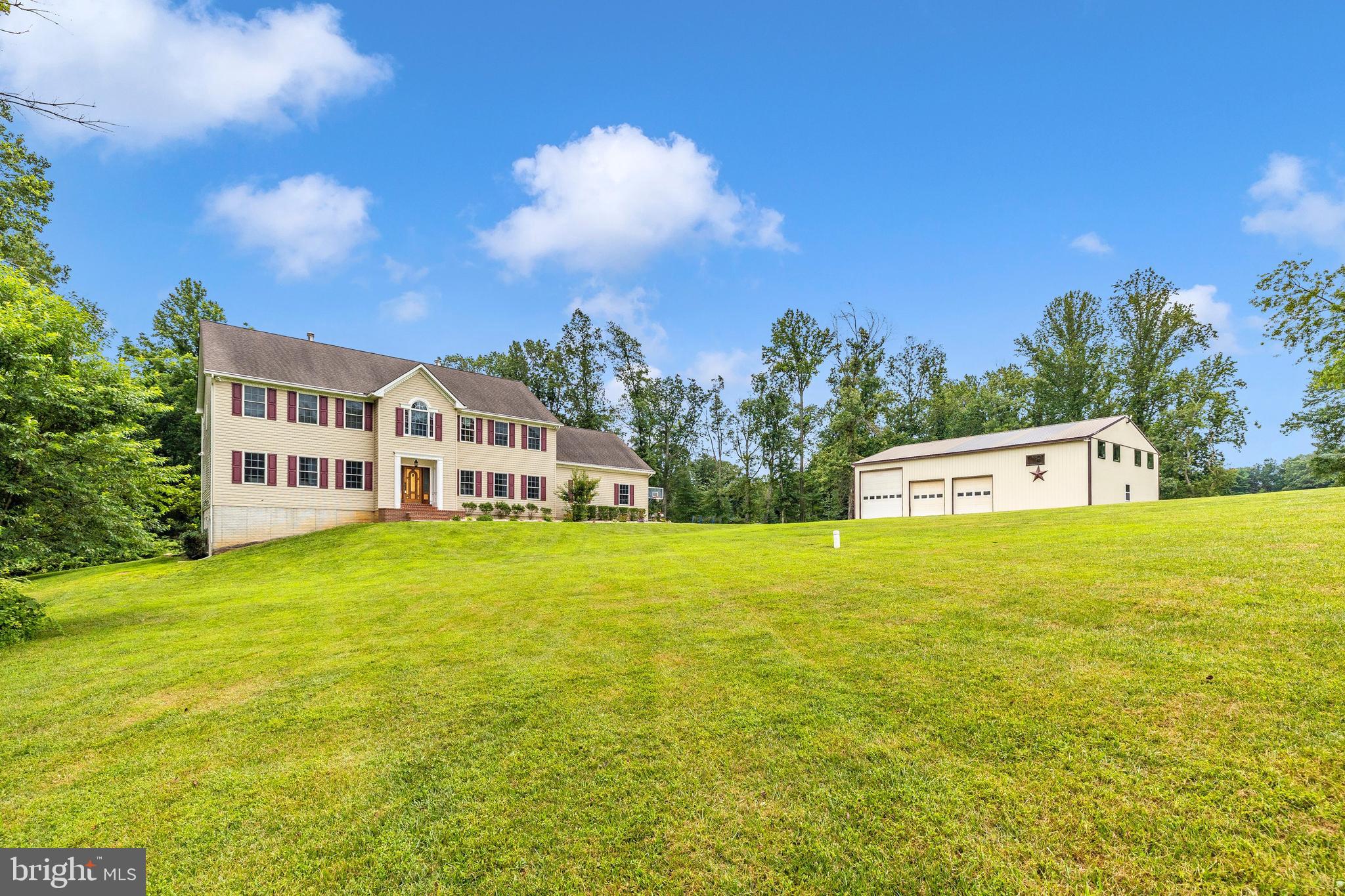 Bring your farming or retreat dreams to life! A hidden gem in Carroll County, MD, you'll find this custom-built colonial with expansive yard and 63+ acres an endless resource of possibilities! This one-of-a-kind home offers multiple and expansive opportunities with a separate lower level living area, 2 main level powder rooms, laundry on each floor, custom, gourmet kitchen with oversized island, luxury primary suite, multiple bedrooms, library, a 3 car garage, brand new 14x20' deck, and detached 40x60' pole barn with 3-bay doors, 16 ft. ceilings, separately metered for electric, and in-use water.
The 50 acres of rolling woodland are perfect for privacy and hunting with an abundance of wildlife. Property has approximately 11 acres of cleared pasture, seeded for grass-fed cattle, which could be converted for equine. Woodland backs up to a private stream with a clearing and a campsite. Established trails for horseback riding, walking, hunting & recreational vehicles make stream and river access easy. Located on the west side of the property is the North Patapsco River. The fenced pasture has 16 ft on-center fence posts. 2 Run-in shelters, 3 water troughs, each with their own heater, separate shut off valves, and breaker, fed by a 20+ gal per minute well. Protected in the Legacy, Forest Conservation, and FIDS programs, Ask for more information. Recent updates include: Upper level HVAC: July 2019 Composite deck off the kitchen: March 2025 Lower Level finished basement with kitchenette and full bath: March 2025 9'x5' kitchen island w/ quartz countertop: March 2022 16' x 36' Barn Mezzanine: April 2024 16'x 22' Run-in Shed: July 202 20' x 22' Run-in Shed: March 2023 Barn Concrete & Electric Service: March 2021 Water Trough water piping and electric: November 2020 Other info: House is on 400 amp service Pole Barn is on 200 amp service metered separately: March 2021 Extreme privacy yet still within close proximity to Westminster shopping and commuter routes MD-140 (6.4 mi), MD-97 (6.4 mi), MD-30 (7 mi.) and I-795 (17.3 mi.) Reach out to schedule your private showing of this extremely rare opportunity now!