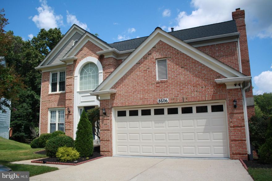 Nestled in the desirable Woodbridge Crossing neighborhood, this classic Colonial-style detached home offers a spacious 5 bedrooms, 4 bathrooms (including 2 full baths and 2 thoughtfully placed half baths), and about 2,272 sq ft of refined living space across three levels.  Built in 1990, the home stands proud on a generous 0.23-acre lot (approximately 9,864 sq ft)—a perfect balance of indoor comfort and outdoor opportunities. Enjoy bright, open spaces with a main level half bath for guest convenience, and a cozy fireplace anchoring the living area for soft ambiance on quiet evenings.  The fully finished basement adds significant functional square footage—ideal for a family room, play area, or home office.  Comfort is assured year-round with central A/C (electric) and central heating (natural gas) systems in place, plus public sewer and water connections for modern reliability.   The lot provides an extended driveway  for parking multiple vehicles.