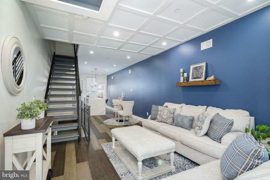 Seldom does an opportunity arise to own a home like this--especially with this huge price reduction. Welcome to 612 McClellan Street, a custom built 4 BR/3 BA home with no detail overlooked. The showcase exterior is just the beginning to the numerous fine details noticed throughout. Upon entry to the home, you are immediately greeted by beautiful hardwood floors complimented by ceiling accents above. Continue through the dining area where a stunning kitchen with premium KitchenAid appliances, superior quality soft-close cabinets and a vibrant backsplash awaits. The extra-large island is an essential gathering hub complimented with additional storage and large built-in wine cooler. Located behind the sun-filled glass door of the kitchen will be the first of your four private outdoor spaces with added fence height for additional privacy. On the second floor you will find two large bedrooms and a full bathroom with custom cabinets. Large windows invite abundant natural light from all angles. The third floor features the grand primary suite with walk-in closet, large sleeping area and sliding glass doors revealing a large second outdoor space. Create your daily spa-like experience with the over-sized primary bathroom showcasing a giant shower, soak-in tub, wide dual vanities, and custom cabinets. Elevate your bathroom spa experience with a third private outdoor space where you can enjoy your favorite drink while listening to the bird's chirp or your favorite tunes. The highest floor has a beverage center leading up to the expansive private rooftop patio for you to enjoy beautiful views of the Center City skyline and South Philadelphia stadiums. The finished basement features a third full bathroom and flex space, which can be used as a bedroom, den, gym, library, theater room, etc. Recessed lighting, custom floor-to-ceiling and wall-to-wall tiled bathrooms, Ring security system, and an enclosed trash space are just some additional thoughtful details of this meticulously designed home. Included is 6-7 years remaining on the original tax abatement. Seventy-five newly built luxury homes/condos across the street along with countless rehabs and new construction projects continue to enrich this bustling area of South Philadelphia. Just blocks away from the Historic Bok building and East Passyunk Square where you will find some of the finest restaurants, bars, boutique shops, supermarkets, and gyms in Philadelphia. Numerous Septa routes nearby.