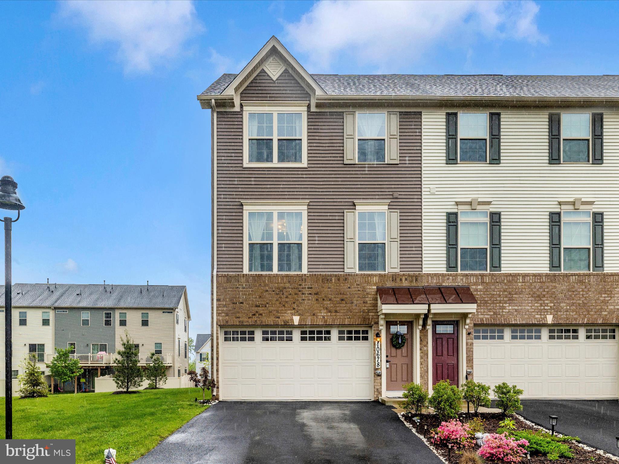 ***INCREDIBLE & IMMACULATE HOME WITH 3 FULLY FINISHED LEVELS & ONLY 3 YEARS YOUNG***FRESH PAINT THROUGH OUT***BEAUTIFUL BRICK & SIDING END UNIT HOME IN THE LOVELY HAMPTONS VILLAGE OF AMENITY RICH LAKE LINGANORE***BUILT IN 2022 & ENJOYING OVER 2000 SQUARE FEET OF LUXURY LIVING***OPEN & SUNLIT LAYOUT WITH A GOURMET KITCHEN WITH CLASSY BEIGE CABINETRY WITH QUARTZ COUNTER TOPS, A HUGE ISLAND WITH SEATING, STAINLESS STEEL APPLIANCES WITH A BUILT IN MICROWAVE, FRENCH DOOR REFRIGERATOR, NATURAL GAS COOKING, & STYLISH GREY LVP FLOORING***LARGE DECK***2 CAR GARAGE***FINISHED BASEMENT WITH WALK OUT & HALF BATH***ADDITIONAL COMMUNITY PARKING AVAILABLE ACROSS THE STREET***READY FOR A QUICK MOVE IN***MUST SEE***