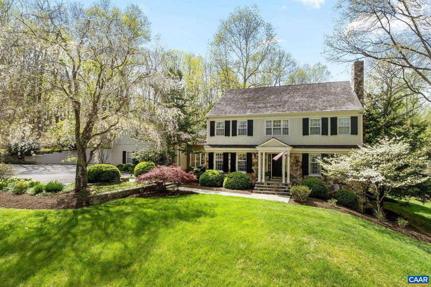 HEART OF WESTERN ALBEMARLE! This sprawling stone + cedar farmhouse-style home epitomizes the charm + comfort of easy country living, ideally set on on a quiet cul de sac in sought-after SPRING HILL just 8 mins to Boar?s Head/Farmington w/ Murray + W Alb schools. Gorgeous CURB APPEAL, this 5 bed home is a true gem set amidst 3.53 ACRES of wooded views, stone walls + meticulously landscaped grounds inc. a stunning weeping cherry tree in full bloom! Inside, a comfortable floorplan tastefully melds 5,263 sf of timeless elegance + modern convenience feat. extensive trimwork/built-ins, hardwoods, solid wood doors + plentiful windows to take in the picturesque views. The main level feat. a seamless blend of gracious formal + informal living spaces inc. handsome gourmet kitchen w/ ample counters, island + heart-pine cabinets... plus a study (or 1st flr bed?) w/ beautiful built-ins. Upstairs, the primary bedroom suite is accompanied by 3 add'l generous bedrooms + 2 full bathrooms plus an add'l bedroom suite above the 2-car garage.  Full, walkout terrace level offers more living + storage. Perfect backdrop for outdoor enjoyment + tranquility while an easy 18 mins drive to UVA + Downtown Charlottesville.,Solid Surface Counter,Wood Cabinets,Fireplace in Den,Fireplace in Living Room