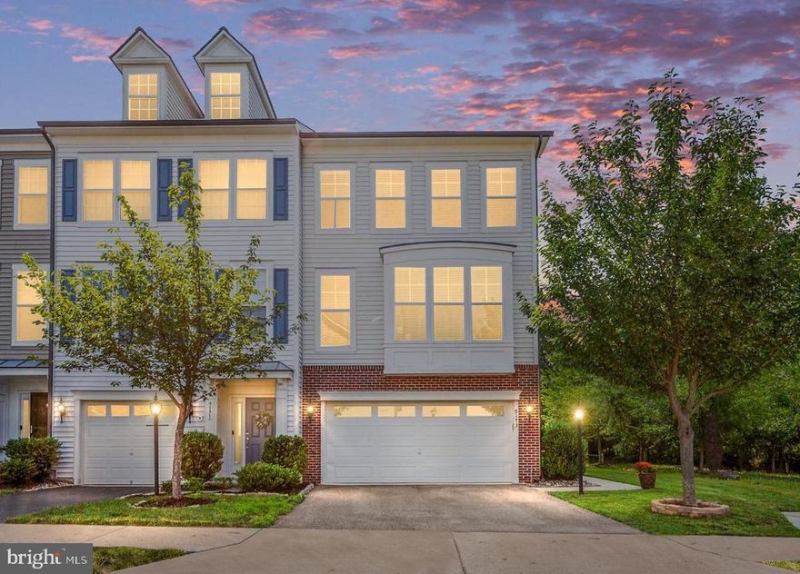 This beautifully maintained, three-level end-unit townhome with a two-car garage is ideally situated in the desirable Victory Lakes/Pembrooke community. Offering exceptional privacy, the home backs to mature trees and green space on two sides, with unobstructed views of the Blue Ridge Mountains from the front windows. Bright & spacious with an open floor plan, this home has been professionally cleaned bi-weekly. Recent updates include new luxury vinyl plank flooring on the upper level in 2023.  Conveniently located less than five miles from public transit, grocery stores, shopping, and entertainment. The HOA provides access to a wide range of amenities, including community maintenance, a pool, clubhouse with event space, gym, dog park, playground, and sports facilities. Located in the heart of Bristow, this is truly a home not to miss!