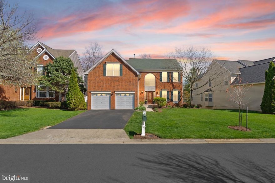 Discover this stunning Toll Brothers Norfolk model home in the beautiful, gated Belmont Country Club community of Ashburn. Enjoy access to resort-style amenities that support an active and vibrant lifestyle.

Inside, the main level showcases hardwood floors, crown molding, and abundant natural light throughout. The renovated kitchen features solid wood, soft-close cabinetry with rich grain detail, granite countertops, and a large center island ideal for both everyday living and entertaining. Additional highlights include stainless steel appliances, a gas cooktop, and double wall ovens. The kitchen opens to a Trex deck overlooking a private, wooded backyard perfect for relaxing or hosting guests. 

A main-level office and a spacious family room with a vaulted ceiling and gas fireplace create a bright, open, and welcoming living space. The main level also includes a formal dining room and a separate sitting room, offering flexibility for both entertaining and everyday use.

Upstairs, the primary suite features a vaulted ceiling, two walk-in closets, and ample space for a sitting area. The ensuite includes dual vanities, a walk-in shower, and a soaking tub for a spa-like experience. Three additional bedrooms and a fully renovated hall bathroom complete the upper level.

The home has been extensively updated in 2025, including a renovated secondary bathroom with quartz countertops, a solid wood vanity, beautiful tile flooring, and soft-close shower doors; a fully updated main level powder room with new marble flooring, lighting, vanity and paint; full interior repaint (including the garage); new washer and dryer; updated light fixtures and ceiling fans throughout; new basement carpet; new solid oak hardwood flooring on the stairs and upper level; updated window blinds; new toilets & faucets in the baths; and the showerhead in the primary bath. Previous updates include HVAC (2021), roof (2014), water heater (2023), insulation, and backyard drainage system.

The finished walkout basement offers a large recreation space ideal for a home theater, complete with a wet bar and flexible open area suitable for a gym, music space, or additional entertainment. A full bathroom and utility room add convenience and storage space.

Additional features include a two-car garage, private driveway, and easy access to school bus pickup. The backyard features a tranquil koi pond with a cascading waterfall, surrounded by seasonal blooms, creating a peaceful, garden-like retreat.

The HOA offers comprehensive coverage, including landscaping maintenance, snow and trash removal, road upkeep, gated access with security, as well as cable and WiFi services—providing a truly low-maintenance lifestyle.

Belmont Country Club membership is required, with tiered options available. The base membership grants access to an exceptional range of amenities, including dining, pools, sports courts, and playgrounds, with optional upgrades for full fitness and golf privileges.

Residents enjoy resort-style living with access to an 18‑hole Arnold Palmer Signature golf course, a historic Manor built in the 1790's, basketball courts, seven tennis courts (hard and clay), pickleball programs, a state-of-the-art fitness center with classes and personal training available with certain memberships, and three pools featuring aquatics programs. The clubhouse offers dining at Lee’s Table & Tavern, along with curated events, private gathering spaces, and access to a nationwide network of affiliated city clubs.

Surrounded by scenic trails, wooded landscapes, and a nearby creek, the community also features a vibrant calendar of events—offering a connected and elevated lifestyle in Ashburn. The home is just minutes away from Belmont Chase with access to restaurants, groceries, and other convenient stores and is minutes away from exit to the Leesburg Pike, ideal for commuting. The home is zoned for Newton-Lee Elementary, Belmont Ridge Middle, and Riverside High School.