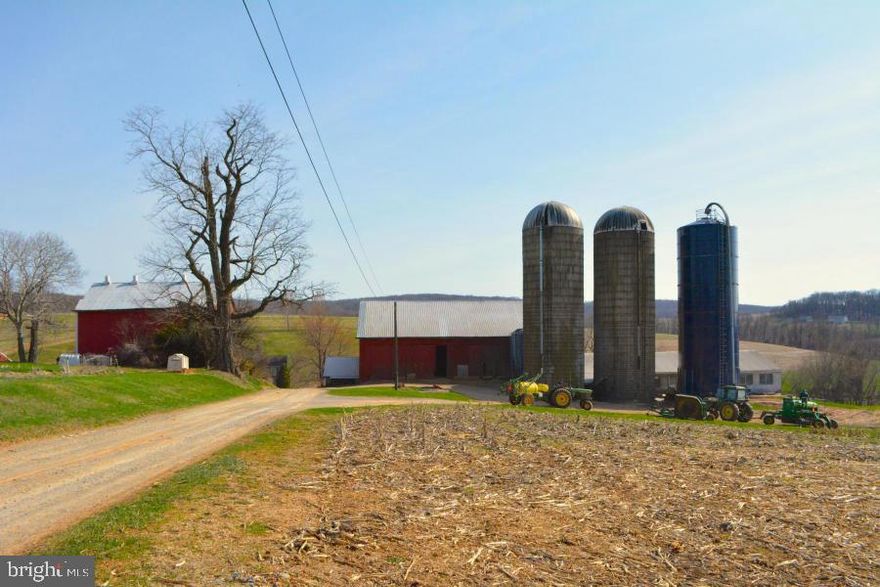 95 Acre Dairy farm with 62 tillable acres, 4 pasture acres, 25 woodland acres, 4 building acres. Has a 45x63 76 Stall Dairy Barn with hay storage above. 14x72 Heifer barn slatted floor with small pit. 17x13 Milk House, 37x43 Bank Barn, 39x20 Out Building, 23x58 Equipment Shed, 2x 20x60 Silo Concrete, 20x60 Silo Harvestore, a 1500sq.ft 2 story farmhouse and a 732 sqft rancher.