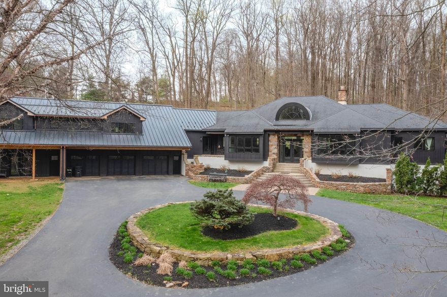 Some properties are simply a home. This one is something more, a rare opportunity for multi-generational living, a private homestead, or a flexible family estate, all wrapped into one extraordinary Chester County property.

Tucked at the very end of a long, semi-private road, 2800 Horseshoe Trail arrives with intention: a sweeping circular driveway, striking new James Hardie board-and-batten siding with stone accents, and 8.5 open, picturesque acres overlooking Birchrun Creek. For buyers who value land, space, and the ability to breathe, this is it. 

What makes this home truly exceptional is its ability to live as one cohesive single-family estate or as a thoughtfully designed property where multiple generations can exist under one roof with genuine independence. The main residence features a dramatic octagonal Great Room with soaring cathedral ceilings, fireplace, custom built-ins, and a full wall of windows framing the natural surroundings. The primary suite is a spa-caliber retreat with heated floors, a cast iron clawfoot tub, quartz countertops, a windowed walk-in shower, and a custom dressing area with walk-in and cedar closets. The updated kitchen offers quartz countertops, hardwood floors, a walk-in pantry, and a sun-drenched breakfast area with access to a hardscape patio. A formal dining room, powder room, and oversized laundry room with its own exterior entrance round out the main level. A short transition from the main living area leads to two additional bedrooms, a shared living space, and a conveniently located second laundry area, offering separation and flexibility within the main home.

The true versatility of this property is further enhanced by a substantial addition, thoughtfully designed with a kitchenette with custom cabinetry, quartz countertops, and new appliances, an open living area, a bedroom with custom walk-in closet, a full bath with seamless walk-in shower, multiple French doors, and a private exterior entrance. Designed to function independently, this space is ideal for aging parents, adult children, long-term guests, or a live-in caretaker.

The lower level continues the story. A fully finished basement offers a remodeled full bath, mirrored wet bar, exercise or lounge area, a bright bedroom, and an unfinished section with windows and outside access — yet another self-contained retreat, perfect for additional living or a flex space that grows with your needs.

In total, the home offers approximately 7,500 square feet of living space across four bedrooms, an office, a den, two living areas, a kitchen and a kitchenette, two laundry rooms, four full baths, and one half bath — all on 8.5 private acres, surrounded by scenic woodlands and premier horse farms, yet minutes from Route 100 and the Pennsylvania Turnpike.

This is not just a house. It is a property designed for the way families actually live.
