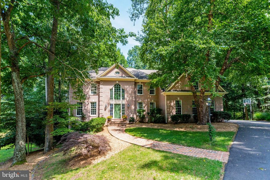 We are proud to present this all brick stately home in the desirable Quarterfield neighborhood inEllicott C ity! The foyer is inviting and impressive and greets you with a beautiful windingstaircase. Arched doorways lead to a lovely living room and spacious dining room featuring crownmolding, chair railing and wainscoting . A two-story family room with lots of windows and a gasfireplace compliments the first level. The main level formal library features beautiful built-ins.Huge kitchen with lovely wood cabinetry and granite counters plus a center island with gascooktop. Light and airy kitchen windows overlook gorgeous deck and backyard. The upper levelmaster suite has a sophisticated tray ceiling, large walk in closets, superb garden luxury bath withsoaking tub and large separate shower and double vanity. An overlook to the two-story familyroom leads to the other three upper level bedrooms. You will find a fifth bedroom and full bath inthe lower level walk out basement. Huge finished lower level with space for a billiards table, asecond gas fireplace and television area in this daylight basement. Quality and class abound inthis home! Make an appointment now!