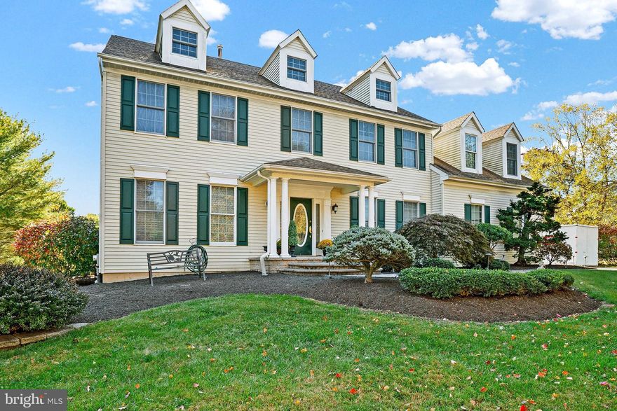 Discover this stunning home on a serene one-acre lot in Buckingham Township, within the highly regarded Central Bucks School District. As you step inside, you'll be greeted by the timeless elegance of hardwood floors, a graceful, curved staircase, and the welcoming two-story foyer.  A versatile office or den, ideal for remote work or a quiet retreat, is just off the foyer. Continue to the gourmet kitchen, a chef’s dream, complete with a large island, granite countertops, tile backsplash, and an abundance of cabinets and counter space. The bright & sunny breakfast room offers plenty of space for dining. A walk-in, lighted pantry offers additional storage, ensuring everything has its place. Just off the kitchen is the warm & inviting family room, a bright and comfortable space with a vaulted ceiling, skylights, a cozy fireplace, and sliding glass doors that open to the deck. Adjacent to the family room and kitchen is a convenient laundry/mudroom with access to the garage. In addition, the main level includes a spacious living room, formal dining room, and powder room. Upstairs, the primary bedroom offers a quiet retreat, featuring tall windows that flood the room with natural light and a walk-in closet with a custom California Closet system. The en-suite bathroom offers a luxurious wraparound vanity, soaking tub and large shower. Three additional generous-sized bedrooms and a full bath complete the upstairs. The finished lower level offers flex space for watching TV, exercising, and entertaining as well as plenty of space for all of your storage needs. Outdoor living is enhanced by a covered deck, perfect for entertaining and viewing your beautiful backyard oasis. The in-ground pool finished with tile and gunite, and a relaxing hot tub are just beyond the deck. The home boasts custom crown molding and wainscotting throughout, adding to its charm and elegance. Recent updates include a new roof, just two years old, newer appliances, and new, luxury vinyl flooring in the basement. Much of the home is freshly painted. This exceptional neighborhood is within walking distance of two parks, is on a walking/biking trail, close to schools and shopping, and just minutes from Doylestown Borough. Schedule your showing today and imagine your future in this beautiful residence in one of the area's most desirable locations.