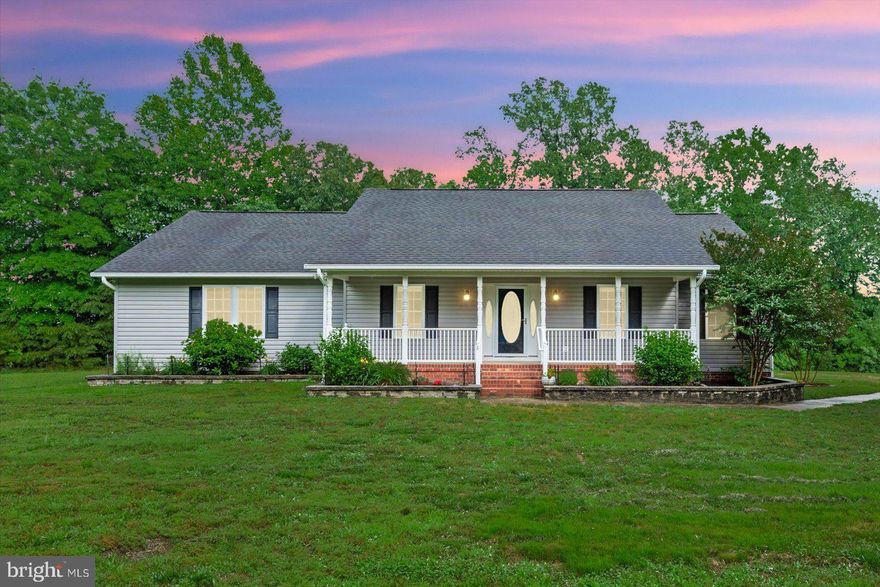 This peaceful home offers a getaway with 7.9 acres of land. Inside, you'll find 3 bedrooms, 2.5 bathrooms, a roomy living area, dining space, and an office, all complemented by a country-style kitchen. The kitchen island provides extra storage with cabinets and open shelving. Don't miss the mudroom adjacent to the kitchen, complete with laundry facilities and a separate entrance to the 2 car garage!
 Also additions like gutter guard and invisible fence. Step outside to the fenced backyard and relax on the screened porch, listening to the chirping birds and the gentle rustle of the wind in the trees while sipping your morning coffee. 
And don't forget to check out the spacious detached garage, featuring three doors and ample room for your DIY projects. (Detached garage has hook-ups/piping for septic. Size 30'x60')
Despite the serene country setting, you're conveniently close to I-95 for easy commuting. Don't let this gem slip away—schedule a viewing today before it's too late!