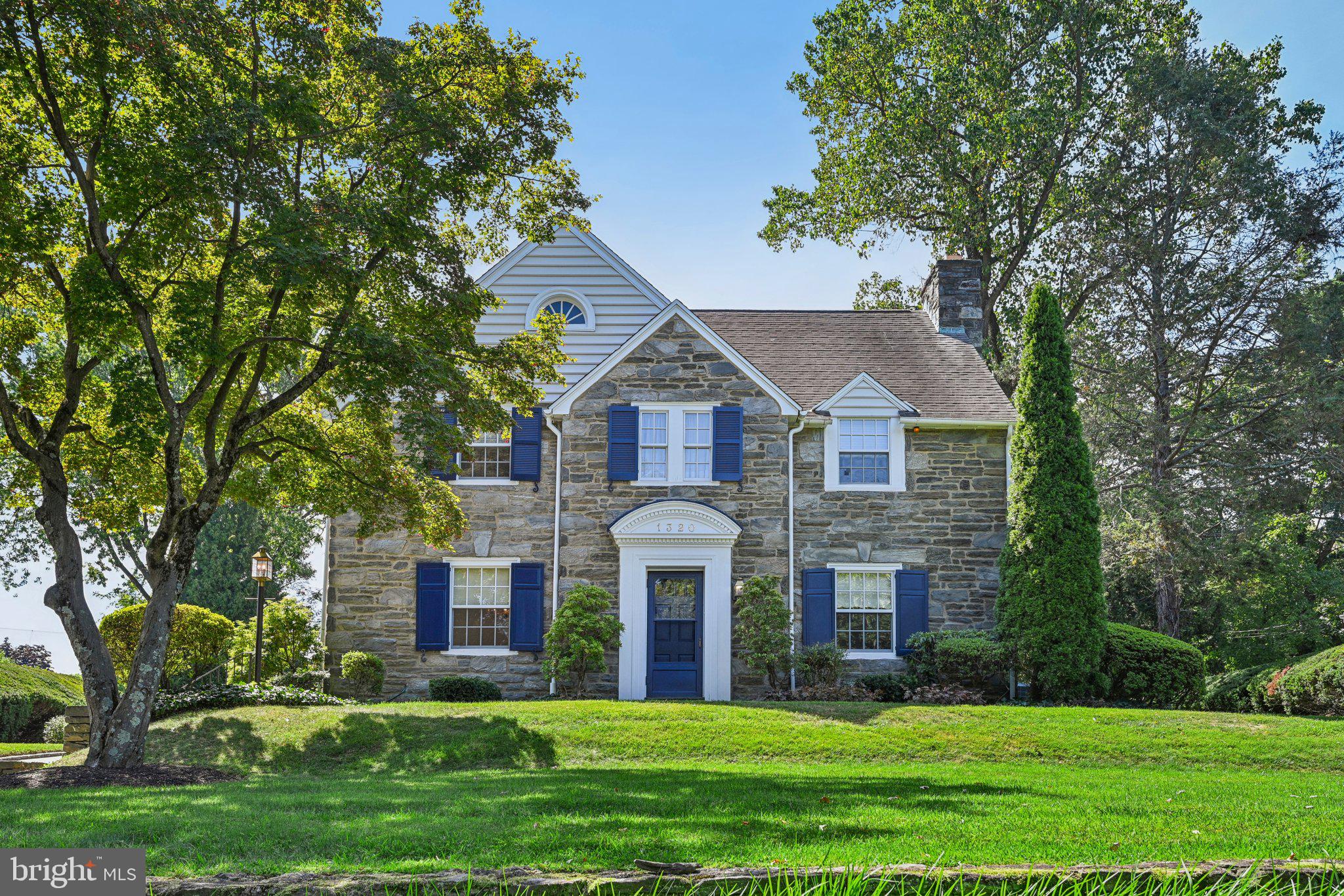 Welcome to 1320 Grenox Road, Wynnewood, PA—a pristine real stone colonial that has been impeccably maintained by the current owners. The home sits high on the hill in this sought after neighborhood within walking distance to South Ardmore Park, the town of Ardmore and 2-3 train stations, 20-25 minutes to the airport or downtown Philly. This is one of those special streets that has block parties and real neighbors! This home seamlessly combines elegance, comfort and convenience. The exquisite property boasts 4 spacious bedrooms and 3 bathrooms – Primary bath was renovated in 2018. This gracious home offers an expansive 2,986 square feet of living space not including the finished basement (approx. 700 finished sq ft in the basement) or the unfinished attic that could be finished(yes, it's that big).
Step inside where real hardwood floors abound. Enter the foyer and see a staircase leading to the second floor. To the right is a large formal living room with wood burning fireplace and windows with deep reveals. There are built-in shelves flanking the fireplace from a bygone era that revered architectural details. The home is spacious and welcoming. The dining room is large and has corner cabinets that allow you to show off your treasures. The glass chandelier provides a beautiful focal point to light up your dining experience. The kitchen is just behind the dining room or accessible through the rear hallway. This area was thoughtfully designed with an open layout opening to the beverage station with bar seating, On the other side of the bar area is a full bath, the laundry closet w/plenty of storage. The original garage was renovated into living space in approximately 1998 and a family room and music room were added. This area could be reconfigured as an au paire or in-law suite if needed. This home is perfect for both entertaining and intimate gatherings. The cook’s kitchen is a dream, featuring high-end appliances, ample counter space, and Wood Mode cabinetry topped with a corian counter. Above the cooktop are 2 shelves that folds down from the warming center to keep food or plates warm for the perfect meal.
Up the stairs to 4 large bedrooms and 2 full baths. The primary suite is a serene retreat, offering ample closet space(a walk in and a 2nd closet) and a private en-suite bathroom. The additional bedrooms are generously sized and well-appointed, ensuring comfort and privacy for everyone. A standout feature of the upstairs hall bath is the soaking tub, perfect for unwinding after a long day or for children’s bubble baths before bed.
Outside, the property is equally impressive. The meticulously maintained grounds span 18,000 square feet and feature professional landscaping that enhances the home's curb appeal. There are many special plantings including a fig tree that is planted along the rear of the garage and provides great figs . In addition there are 2 beautiful Fringe trees that flank the patio. The covered flagstone patio provides an elegant outdoor living area, ideal for alfresco dining and relaxation.
For car enthusiasts, a covered breezeway keeps you dry as you make your way to the detached oversized two-car garage and offers ample storage both in the garage and with the pull down stairs to the attic space adding to the home's convenience. The Belgian block lined driveway tells you this home is loved and the generator tells you the home loves you, even when the electricity is out!
1320 Grenox Road is not just a home; it's a lifestyle. Experience the perfect blend of luxury and practicality in a coveted Wynnewood location. Don't miss the opportunity to make this exceptional property your own.