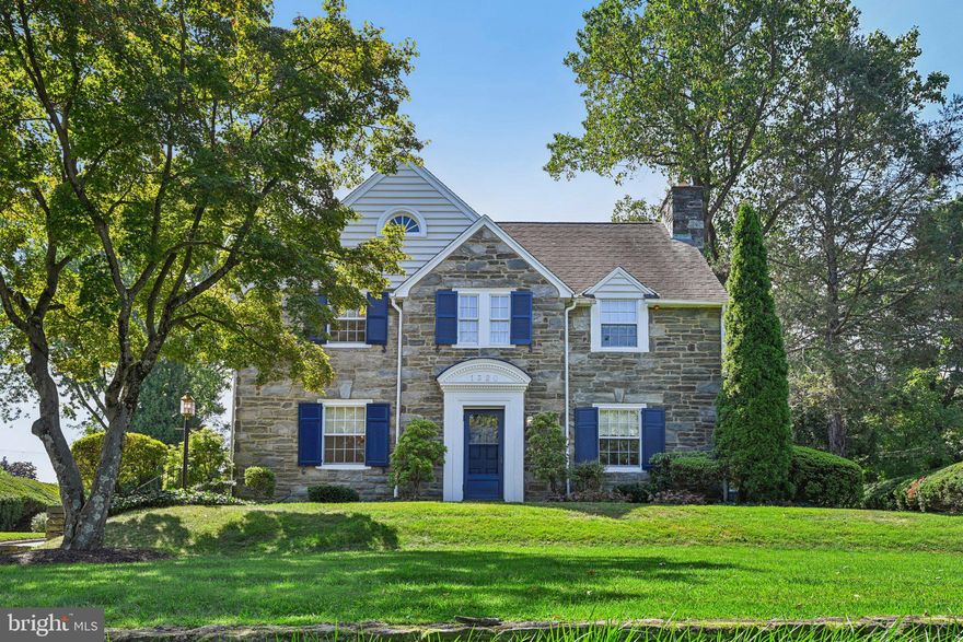 Welcome to 1320 Grenox Road, Wynnewood, PA—a pristine real stone colonial that has been impeccably maintained by the current owners. The home sits high on the hill in this sought after neighborhood within walking distance to South Ardmore Park, the town of Ardmore and 2-3 train stations, 20-25 minutes to the airport or downtown Philly. This is one of those special streets that has block parties and real neighbors!  This home seamlessly combines elegance, comfort and convenience. The exquisite property boasts 4 spacious bedrooms and 3 bathrooms – Primary bath was renovated in 2018. This gracious home offers an expansive 2,986 square feet of living space not including the finished basement (approx. 700 finished sq ft in the basement) or the unfinished attic that could be finished(yes, it's that big).
Step inside where real hardwood floors abound. Enter the foyer and see a staircase leading to the second floor. To the right is a large formal living room with wood burning fireplace and windows with deep reveals. There are built-in shelves flanking the fireplace from a bygone era that revered architectural details. The home is spacious and welcoming. The dining room is large and has corner cabinets that allow you to show off your treasures. The glass chandelier provides a beautiful focal point to light up your dining experience. The kitchen is just behind the dining room or accessible through the rear hallway. This area was thoughtfully designed with an open layout opening to the beverage station with bar seating, On the other side of the bar area is a full bath, the laundry closet w/plenty of storage. The original garage was renovated into living space in approximately 1998 and a family room and music room were added. This area could be reconfigured as an au paire or in-law suite if needed. This home is perfect for both entertaining and intimate gatherings. The cook’s kitchen is a dream, featuring high-end appliances, ample counter space, and Wood Mode cabinetry topped with a corian counter. Above the cooktop are 2 shelves that folds down from the warming center to keep food or plates warm for the perfect meal.
Up the stairs to 4 large bedrooms and 2 full baths. The primary suite is a serene retreat, offering ample closet space(a walk in and a 2nd closet)  and a private en-suite bathroom. The additional bedrooms are generously sized and well-appointed, ensuring comfort and privacy for everyone. A standout feature of the upstairs hall bath is the soaking tub, perfect for unwinding after a long day or for children’s bubble baths before bed.
Outside, the property is equally impressive. The meticulously maintained grounds span 18,000 square feet and feature professional landscaping that enhances the home's curb appeal.  There are many special plantings including a fig tree that is planted along the rear of the garage and provides great figs . In addition there  are  2  beautiful Fringe trees that flank the patio. The covered flagstone patio provides an elegant outdoor living area, ideal for alfresco dining and relaxation.
For car enthusiasts, a covered breezeway keeps you dry as you make your way to the detached oversized two-car garage and offers ample storage both in the garage and with the pull down stairs to the attic space adding to the home's convenience. The Belgian block lined driveway tells you this home is loved and the generator tells you the home loves you, even when the electricity is out! 
1320 Grenox Road is not just a home; it's a lifestyle.  Experience the perfect blend of luxury and practicality in a coveted Wynnewood location. Don't miss the opportunity to make this exceptional property your own.