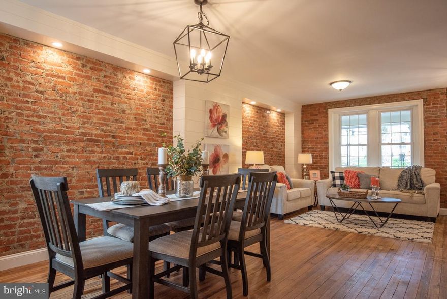 This townhome is beautifully redone and updated, featuring exposed brick throughout. Open the mission style front door into the living area and you can see the main floor layout - living, dining, kitchen. 2nd floor includes the main bedroom, a new bathroom, a laundry area. 3rd floor can be used for office/bedroom spaces. HVAC system. Directly across from Crystal Park. Ready for you to enjoy! **All  offers due by Saturday, October 24, 2020 by 3pm and Seller will then review.**