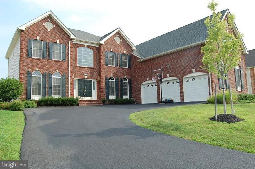 Open and Bright floor plan with many upgrades.  Gourmet kitchen with hardwood floors granite maple cabinets SS appliances, sunroom, 2 story FR with floor to ceiling stone FP, library w/ cherry built-ins, master bedroom sitting area, 2 oversized WI closets, dual head shower, 2 additional baths upstairs, fully finished bsmt, with bar and full bath.Gorgeous patio w/ fire pit.Backs to trees & privacy.