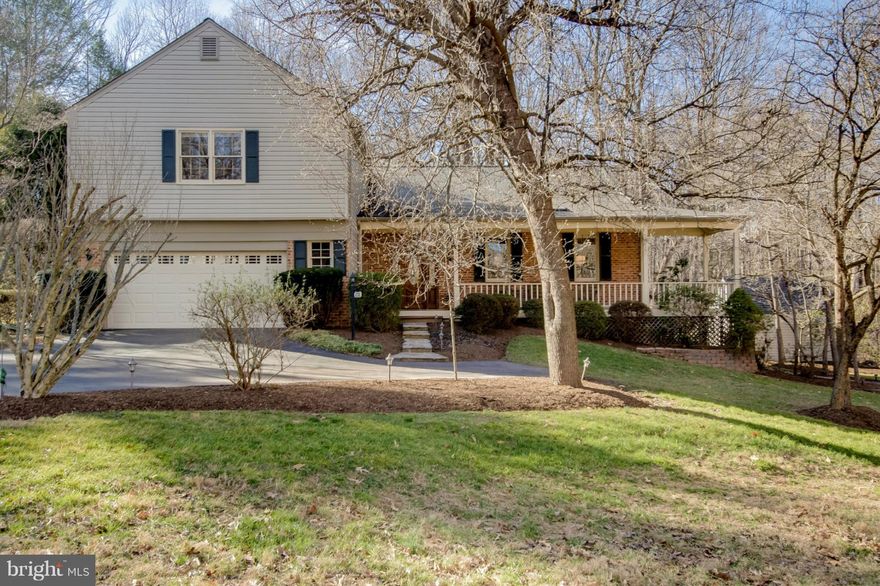 Welcoming, well-built home, orig. owner. Newly updated, freshly painted, new carpet.  Inviting wide front porch. Bright kitchen w/ granite, new SS app. & dining area. Stunning Palladian window, hardwood fl. Finished walk-out LL w/FB, storage area. Surrounded by trees & flowering shrubs. End of cul-de-sac; backs to trees. .47 acre lot.  Great access to Lee Hwy, 66 & shopping. 2 mi. to Wegmans.