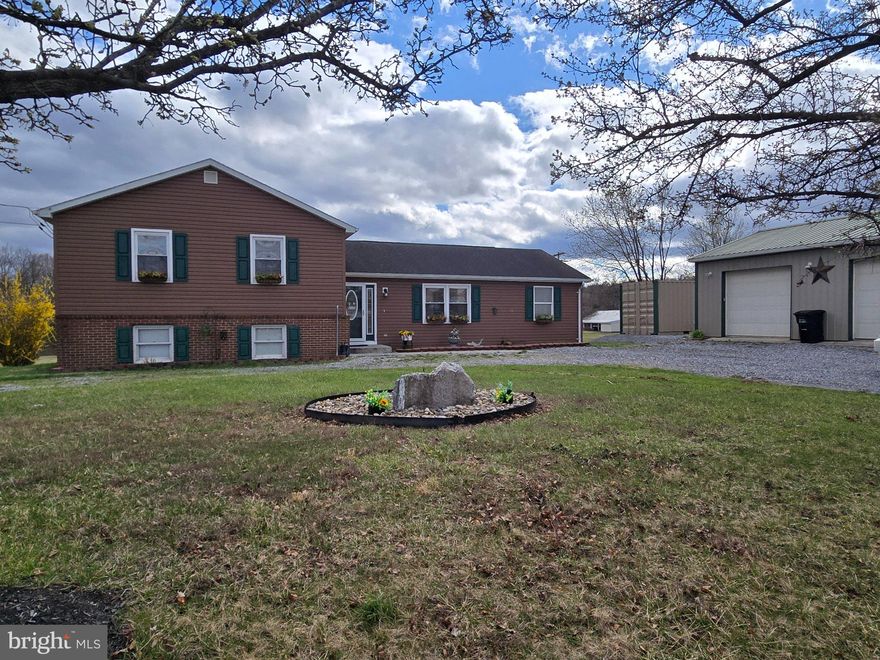 Welcome to your peaceful retreat at 70 Kathys Ln, a charming Split-Level home in Hedgesville, set on a generous 2.02-acre private lot in the Shiloh Farms subdivision. This property offers the perfect blend of country living with convenient access to local amenities. Conveniently located near Lazy-A Camprground and Back Creek. 

Property Highlights:

Spacious Layout: This 1,596 sq ft home features 3 bedrooms and 2 full bathrooms, with 2 finished rooms in the basement with endless possibilities (man cave, exercise room, craft room, playroom, etc).

Outdoor Paradise: Enjoy privacy and tranquility on your expansive 2.02-acre lot, which includes an outbuilding for extra storage or a workshop (a 20' Sea Container is included!).

Interior Features: The home features a bright and welcoming, freshly painted interior as of November 2025 with Luxury Vinyl Plank that was installed in November 2025 and Ceramic Tile flooring, a cozy electric fireplace, and a full set of kitchen appliances including a refrigerator, dishwasher, microwave, and electric oven/range with a new washer & dryer purchased within 2025. 

Convenient Parking: Includes a detached two-car garage and a driveway for additional parking.

Key Utilities: The property is serviced by Central A/C, a Heat Pump (electric backup), water softener and features a well permit on file for water and an on-site septic system.

Built in 1990, this well-maintained home is ready for its next owner. With its brick front, vinyl siding, and architectural shingle roof, it offers durability and classic curb appeal.

Don't miss the chance to own a piece of peaceful Hedgesville real estate!