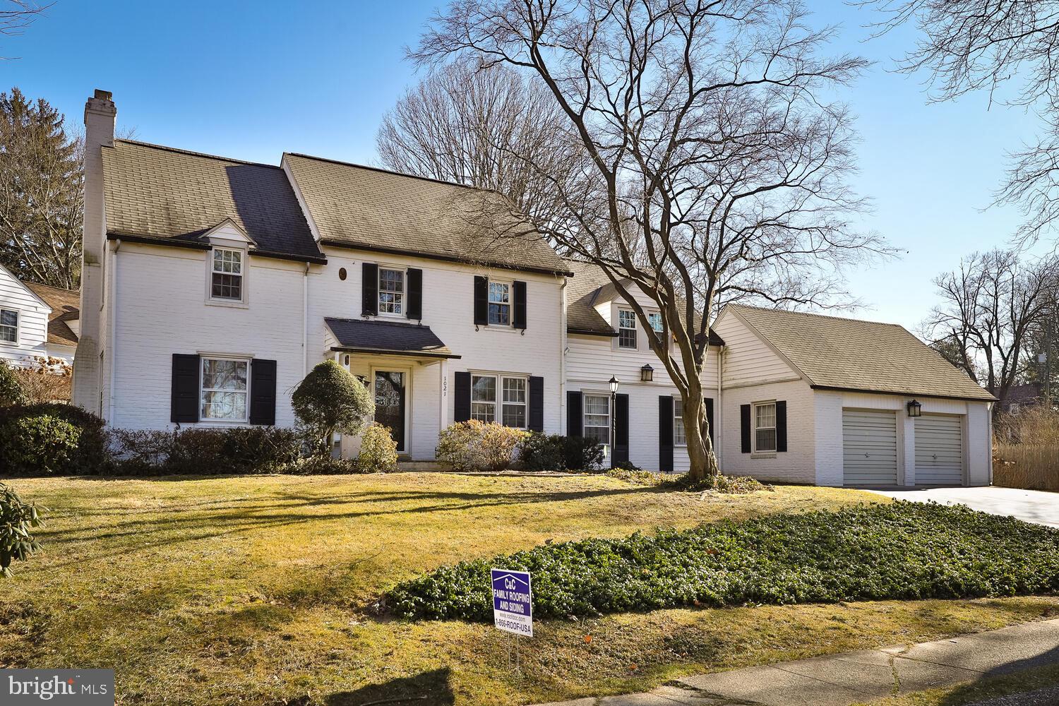 Welcome to a lovely 4 bedroom, 3 and 1/2 bath 2 story brick colonial located in the heart of desirable Jenkintown Manor in Abington Township on a corner lot with mature trees and plantings.  The center hall with coat closet leads to a spacious living room with brick fireplace and hardwood floors under wall-to-wall carpet.  Off the center hall is also formal dining room with a couple steps down into a large family room with double closet, powder room and laundry area behind closed doors.  The kitchen features a stainless gas range, microwave, dishwasher and refrigerator.  There is a stainless deep sink, disposal, Quartz countertops and rear door to the flagstone/brick patios.  Attached to the kitchen is a convenient breakfast room with small desk.  The second floor features the main bedroom with ceiling fan, 2 closets (one closet has stairs leading to a floored attic with attic whole house fan) and ceramic tile main bath with stall shower.  There are 3 additional bedrooms and 2 additional full baths.  An office with ceiling fan, closet and built-in desk area completes this floor.  There is a back staircase with cedar closet leading from the 4th bedroom to the 1st floor.  Unfinished basement with outside exit, gas hot air heater and gas hot (domestic) water heater.  Some replacement windows.  The 2 car attached oversized garage has pull down stairs to a storage loft.  A quick walk to wonderful Alverthorpe Park and just minutes from the Jenkintown Train Station, Whole Foods, Trader Joe's and the quaint shops in Jenkintown.  Located in the Award Winning Abington School District (McKinley Elementary).  You would love living in Jenkintown Manor!