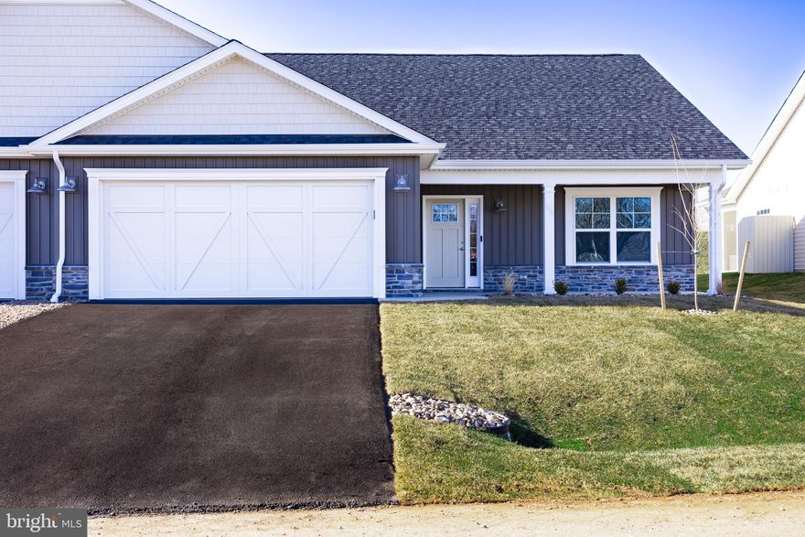 This is the popular Scarlett II model and this particular home has several luxury updates throughout!  It has 3 bedrooms, 3 bathrooms and 2,218 finished square feet.  Enjoy low maintenance living with 100% waterproof Luxury Vinyl Plank flooring all through the main living areas, comfort height commodes, and executive height vanities.  A beautiful electric fireplace with a marbled surround and upgraded mantel makes the living room the perfect cozy retreat for the cool evenings.  The primary bedroom is 16'6" x 15'4" and has a large bathroom and an upgraded Tile Shower with a large niche and a tile bench, double bowl vanity, linen closet and a 10' x 5.5' walk in closet!  Right outside of this suite is another linen closet and a large laundry room upgraded with a sink and base cabinets.  The kitchen has a 7' island with beautiful quartz countertops, a side and end overhang, and deep drawers perfect for your pots and pans.  The cabinetry is all soft close and the upper cabinets go the whole to the ceiling.  There is a separate pantry, a lazy susan, GE appliances and a ceramic tile backsplash!  Bedroom #2 is at the front of the house with a full bathroom right outside of it as well as a coat closet.  This villa comes with a 3rd bedroom, large walk-in closet and a 3rd full bathroom upstairs!  The 3rd bathroom has been upgraded to the DELUXE setup with a walk in shower - linen closet and double vanity! All bathrooms are upgraded with lever vanity faucets! The upstairs space totals 646 square feet and has endless possibilities!  Guest Room, Movie Room, Sewing Room, you name it! In the garage is the addition of ANOTHER storage closet, and there is an insulated mechanical closet with the water heater, air handler and a water softener bypass system.  The amount of storage in this home is incredible.  Outside, there is a front covered porch as well as an upgraded 12X12 Rear Porch!  Fan Junction boxes have been added throughout in the home, as well as several additional recessed lights.  The home comes with a 1 year builders warranty from Panhandle Homes of Berkeley County and Trane offers a 10 year warranty on the HVAC system.  Construction will be complete Nov. 2024 and ready for you to move in!!  *Pictures include pictures of similar build of the same floorplan, the actual home may have different finishes.