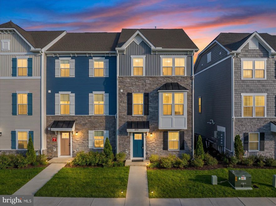 Where Coastal Living Comes With a Rooftop View — End-Unit Townhome at The Landings at Bayside
Welcome to 8644 S Park Drive #1 — an exceptional end-unit Strauss Attic townhome in West Ocean City's premier resort community, The Landings at Bayside. Built new in 2024 and lightly used as a second home — never rented — this property shows like new, offering all the quality of recent construction without the wait.
With 5 true bedrooms, 4.5 bathrooms, 2,765 square feet, and a 2-car garage, it delivers all the space and comfort of single-family living, paired with the easy, lock-and-leave convenience only a townhome can offer.
Being an end unit changes everything. Extra windows on every floor flood the home with natural light. The privacy feels different. The space breathes. You'll feel it the moment you step inside.
The main living level is built for connection. An open-concept living room flows into a bright kitchen anchored by a large quartz island, stainless steel appliances, crisp white cabinetry, and pendant lighting — designed for gathering, entertaining, and the kind of unhurried beach mornings that make weekends here feel like vacation. A sun-filled morning room off the kitchen adds the perfect spot for coffee, casual dinners, and watching the world go by.
The first floor offers smart, flexible living — a private bedroom with en-suite full bath, ideal for guests, multi-generational stays, or a quiet home office. Direct access from the 2-car rear-entry garage means groceries, beach gear, and luggage come in easy.
Upstairs, the owner's suite is your private coastal retreat — a spacious bedroom with king-bed proportions, an enormous walk-in closet, and a spa-style bath featuring a soaking tub, double vanity, and separate tiled shower. Two additional bedrooms, a full hall bath, and a dedicated laundry room complete this level — every space thoughtfully designed for how families actually live.
Then there's the showstopper. Climb to the top floor and you'll find a fifth bedroom with full bath AND a private rooftop deck — the kind of space where sunsets become a daily ritual, summer nights stretch on forever, and "let's go up to the deck" becomes the favorite phrase in the house. This is the view you've been picturing.
Outside the front door, the lifestyle continues. The Landings at Bayside delivers true resort-style living — indoor and outdoor pools, fitness center, game room, tennis courts, playground, crabbing pier, kayak launch, and a beautiful clubhouse — all maintained for you so weekends stay weekends.
Location is everything. Less than 5 minutes to the Ocean City Inlet, minutes to downtown Berlin, and a short ride to Assateague Island's wild beaches. Fine dining, boutique shopping, and the best of the coast — all right at your doorstep.
Built in 2024. Never rented. Lightly used. Move-in ready. Turnkey — without the new-construction wait.
This is the home you've been picturing. Come see it. Live it.
BeachLife Finest.