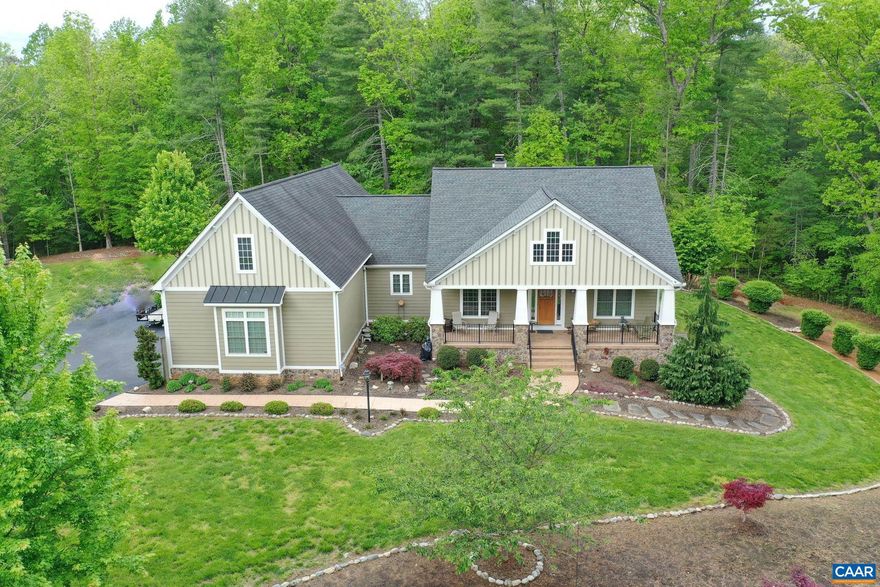 This incredible property offers more than can be described here. It is a gardener and landscaper's paradise. If you are looking for a private escape from the hustle and the convenience of one-level living, this is the one. Inside, you will be greeted by custom woodwork and handcrafted finishes throughout. Enjoy the beautiful garden view from the cozy library with custom built-ins or relax by the living room fire on a chilly day. The family chef will be well-equipped to whip up a meal in the spacious, state of the art, eat-in kitchen while remaining connected to everyone in the open concept living/dining layout. The split bedroom design offers privacy for the primary suite that boasts an ensuite with dual vanities and spacious closets. Working from home is no problem with the upper-floor bonus room off the primary. The full, unfinished basement is roughed in for endless possibilities including a second kitchen. You really must experience this home for yourself. Schedule your own private tour today!,Granite Counter,Painted Cabinets,Fireplace in Family Room