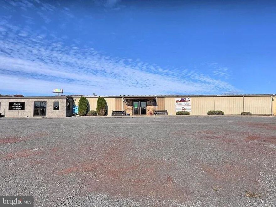This property will be offered at Public Auction on Thursday, October 2, 2025 @ 6pm.  The listing price is the opening bid only and in no way reflects the final sale price.  10% down due at auction, 2% transfer tax to be paid by the purchaser, real estate taxes prorated. This 19,808 sq. ft. metal and concrete block commercial building sits on 2.327 acres and is ideally located just minutes from Routes 35 and 22, in a mixed residential and commercial development area—making it a prime opportunity for your next business venture or expansion. Zoned commercial, the property was formerly home to a 16,750 sq. ft. roller skating rink and a 3,058 sq. ft. restaurant. It features an overhead door and a large parking area to accommodate customers or staff. The main area includes a large open space, office, snack bar, restrooms, small dining area, and mechanical room. The restaurant area offers a dining space, commercial kitchen, office, and restrooms. The property also includes a 2-bedroom, 1-bathroom mobile home located toward the rear of the lot, offering the potential for additional rental income. Don’t miss this opportunity to own a substantial commercial building in a high-visibility location with excellent access—ideal for a wide range of business uses.